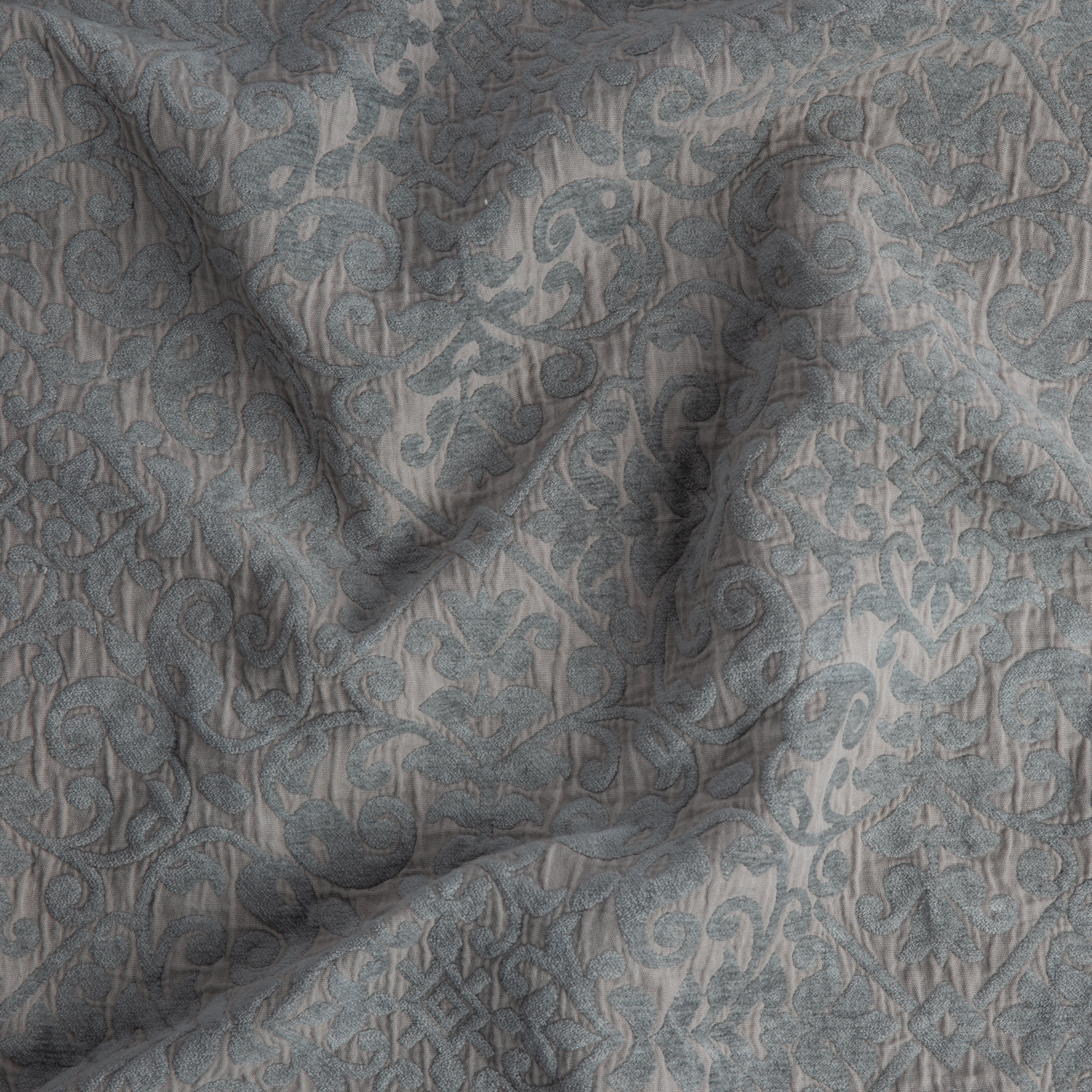 Fog: A close up of Vienna cotton chenille jacquard in fog, a neutral-warm, soft mid-tone grey.