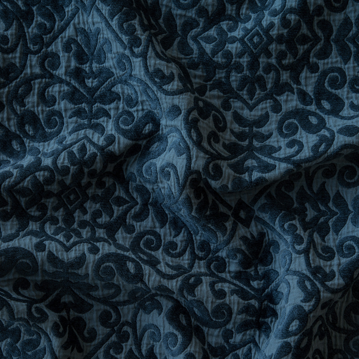 Midnight: A close up of Vienna cotton chenille jacquard in midnight, a rich indigo tone.