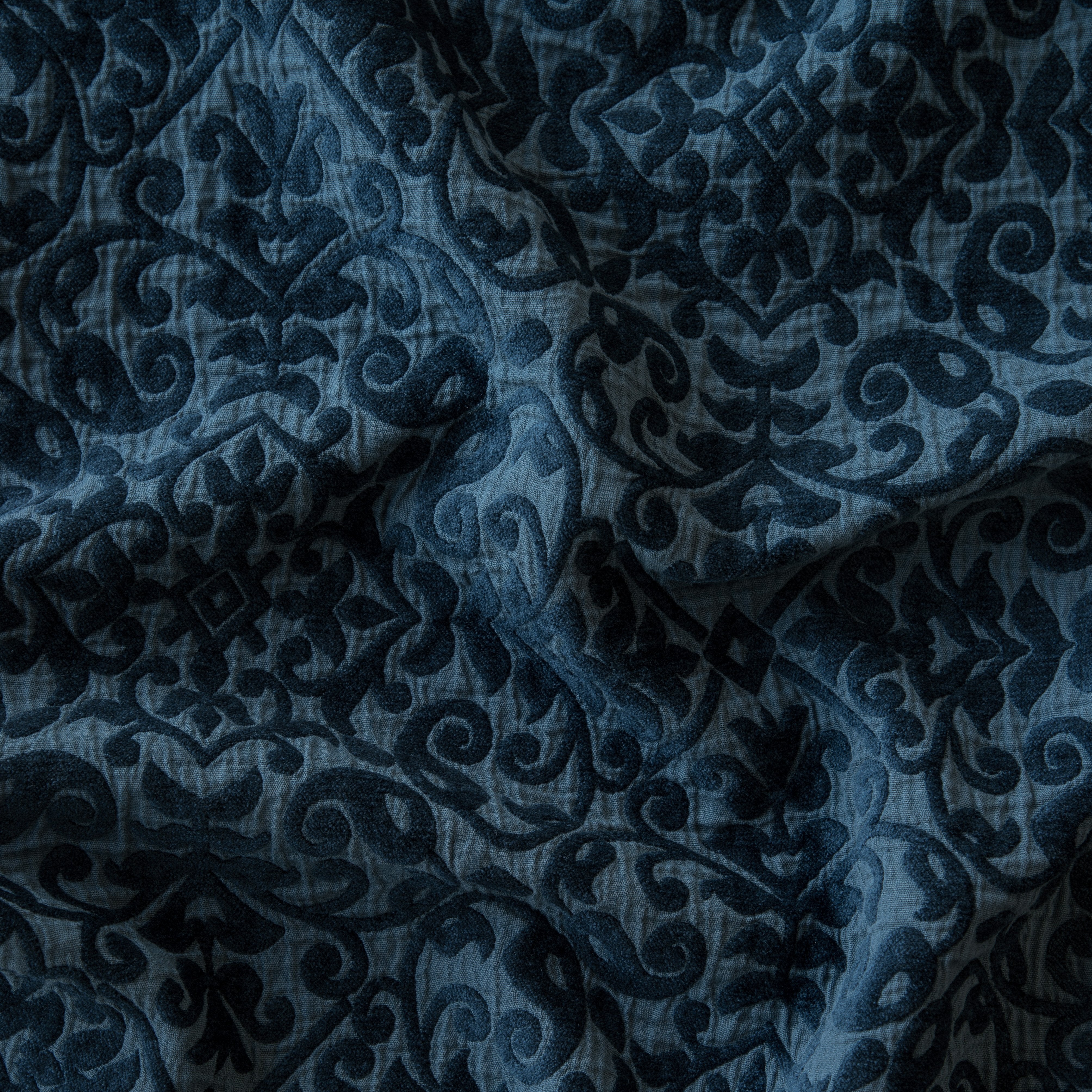 Midnight: A close up of Vienna cotton chenille jacquard in midnight, a rich indigo tone.
