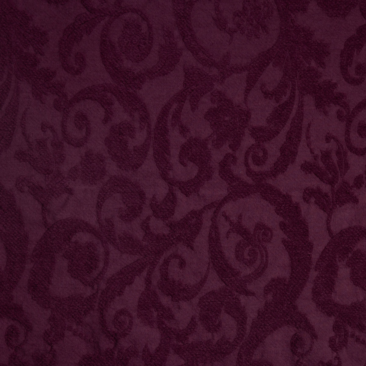 Fig: A close up of Adele fabric in fig, a richly saturated purple-garnet.