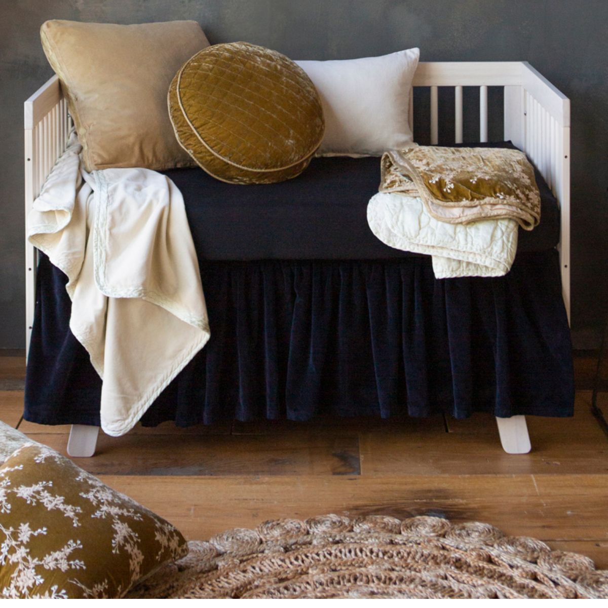 [allvariants]: neutral crib with black crib bedding and neutral colored pillows and baby blankets. 