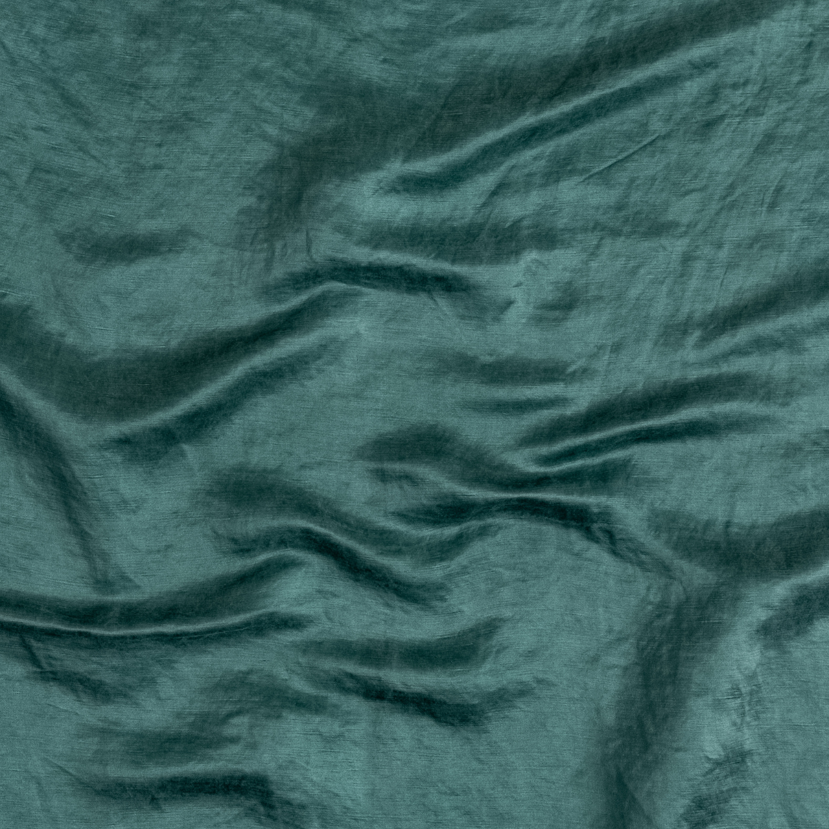 Cenote: A close up of charmeuse fabric in cenote, a vibrant, ocean-inspired blue-green.