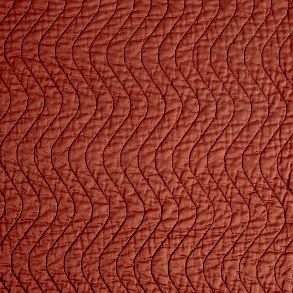 Autumn: A close up of quilted cotton sateen fabric in autumn, a rich persimmon color