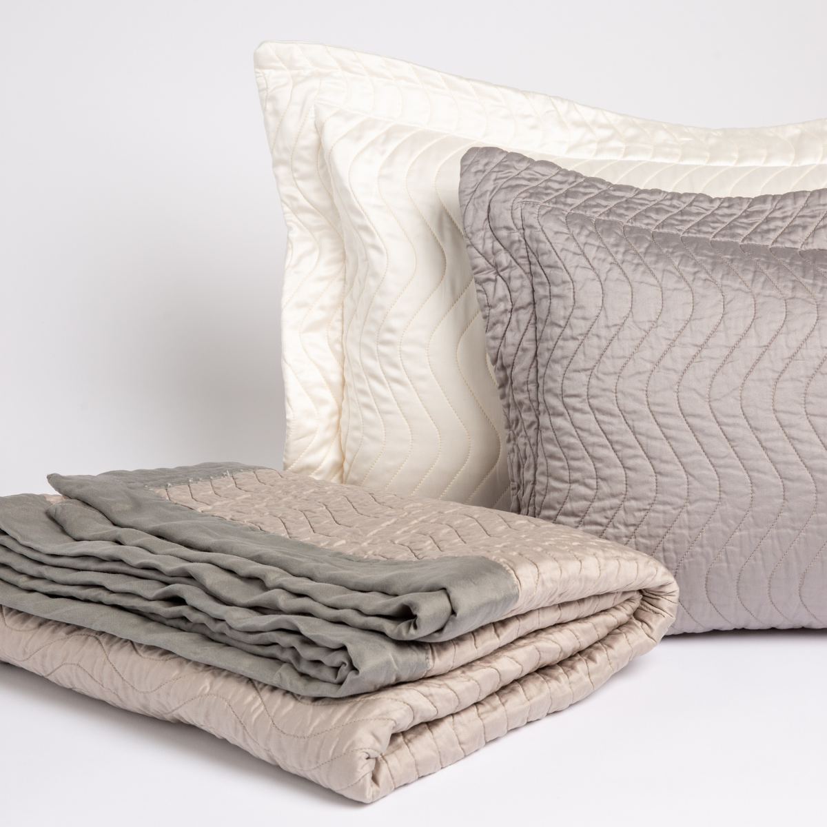 [allvariants]: two qulted cotton sateen throw pillows with a throw blanket trimmed in unquilted cotton sateen. 