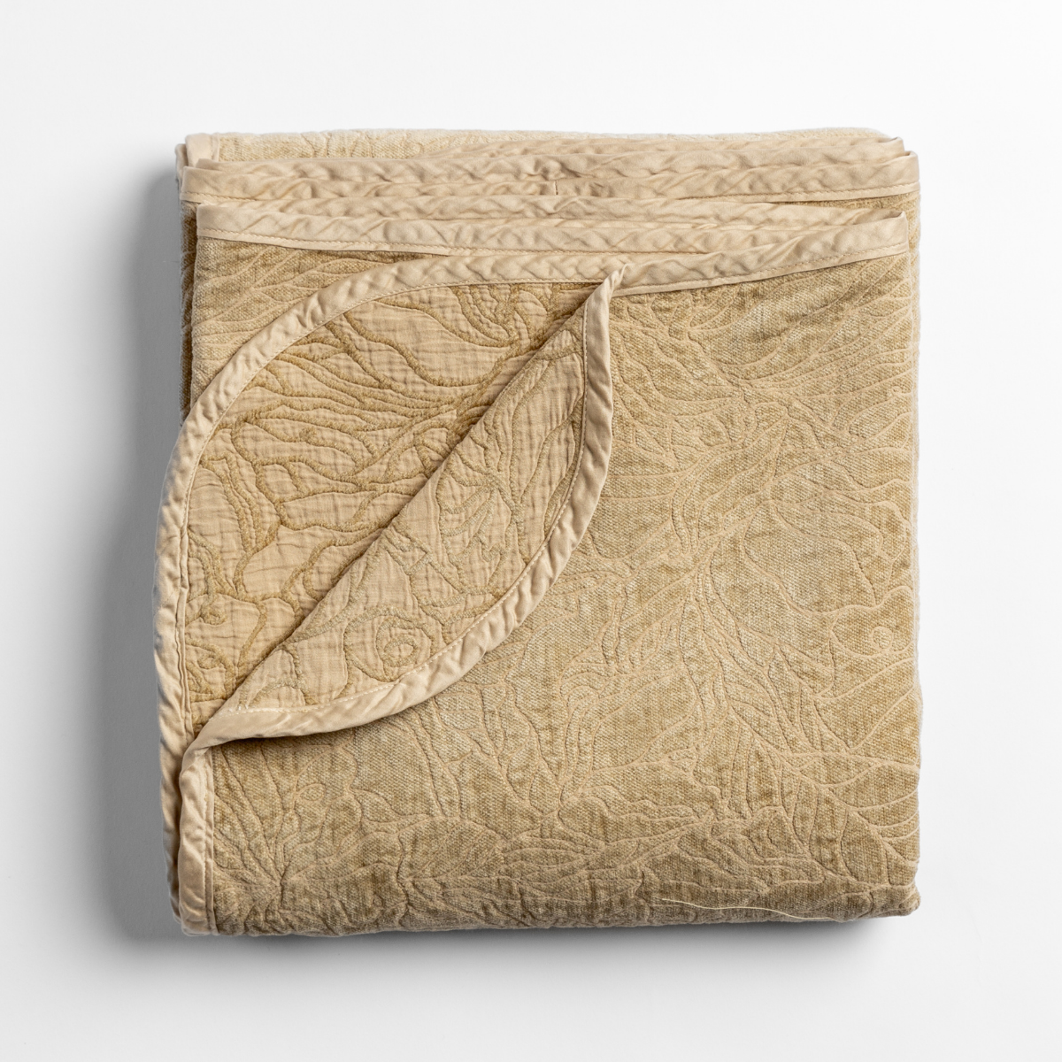 Honeycomb: folded blanket with its cotton jacquard side visible on the corner foldback against the chenille jacquard side. 