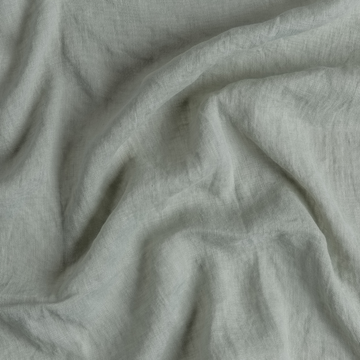 Eucalyptus: A close up of linen whisper fabric in eucalyptus, a soft light green.