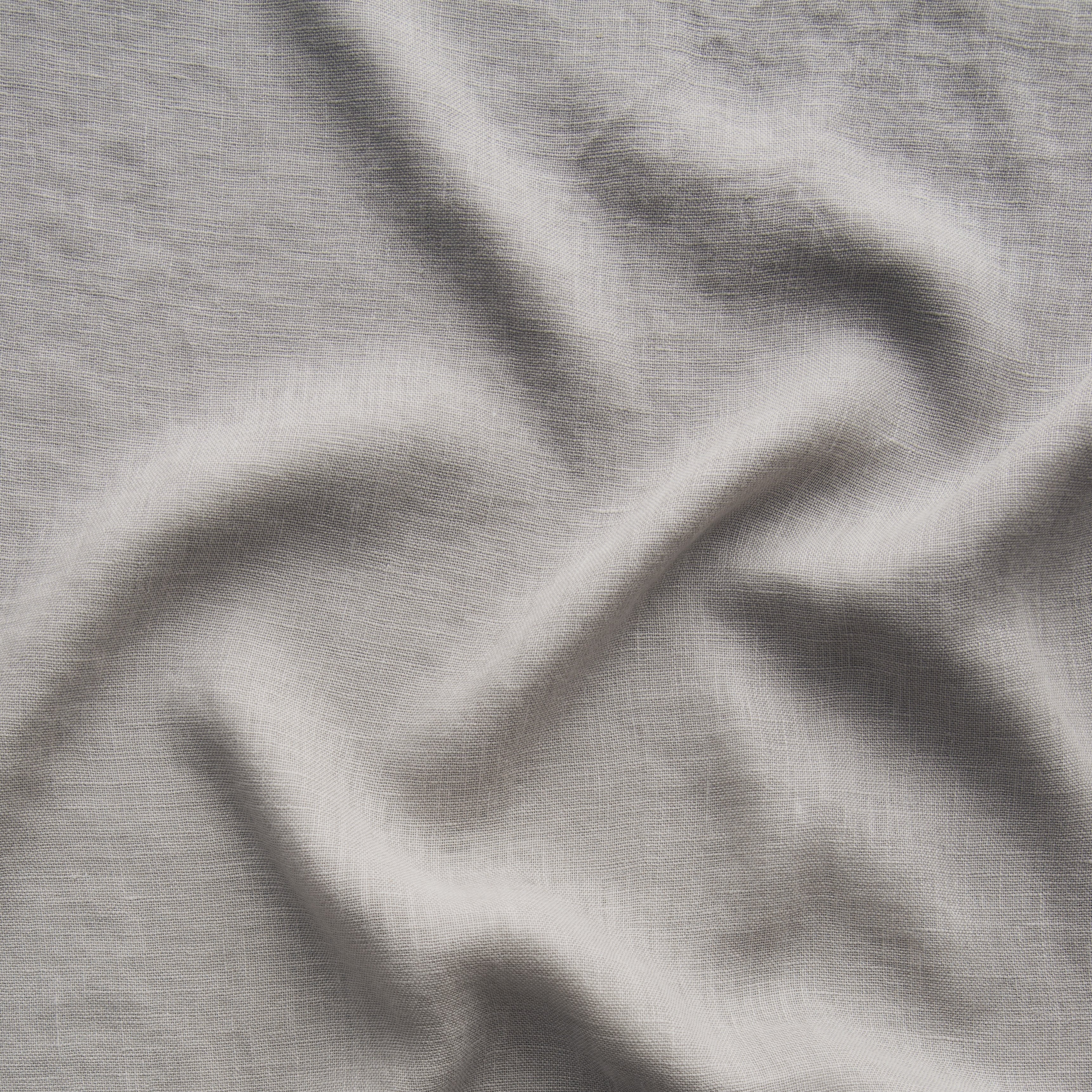 Fog: A close up of linen whisper, our lightweight linen gauze, in fog, a neutral-warm, soft mid-tone grey. 