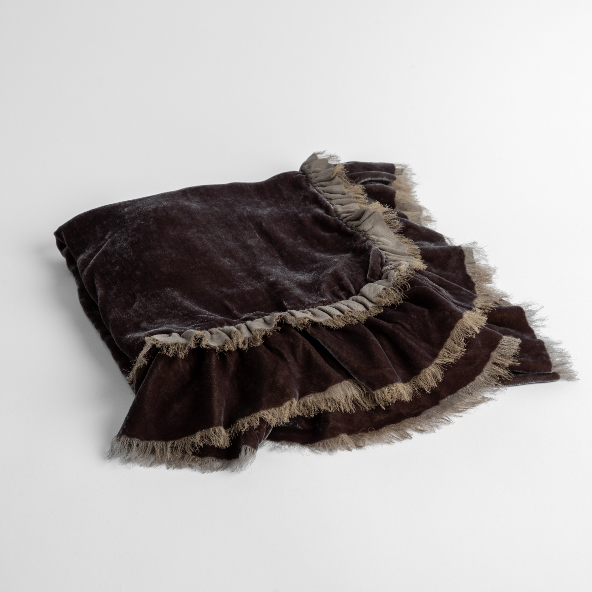 Moonlight:  an overhead shot of a folded silk velvet baby blanket with a raw-edged eyelash ruffle detail.