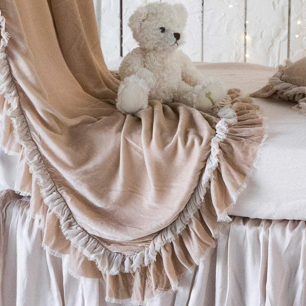 Pearl: Close-up of rumpled Loulah baby blanket in pearl, showcasing the raw edge ruffle trim.