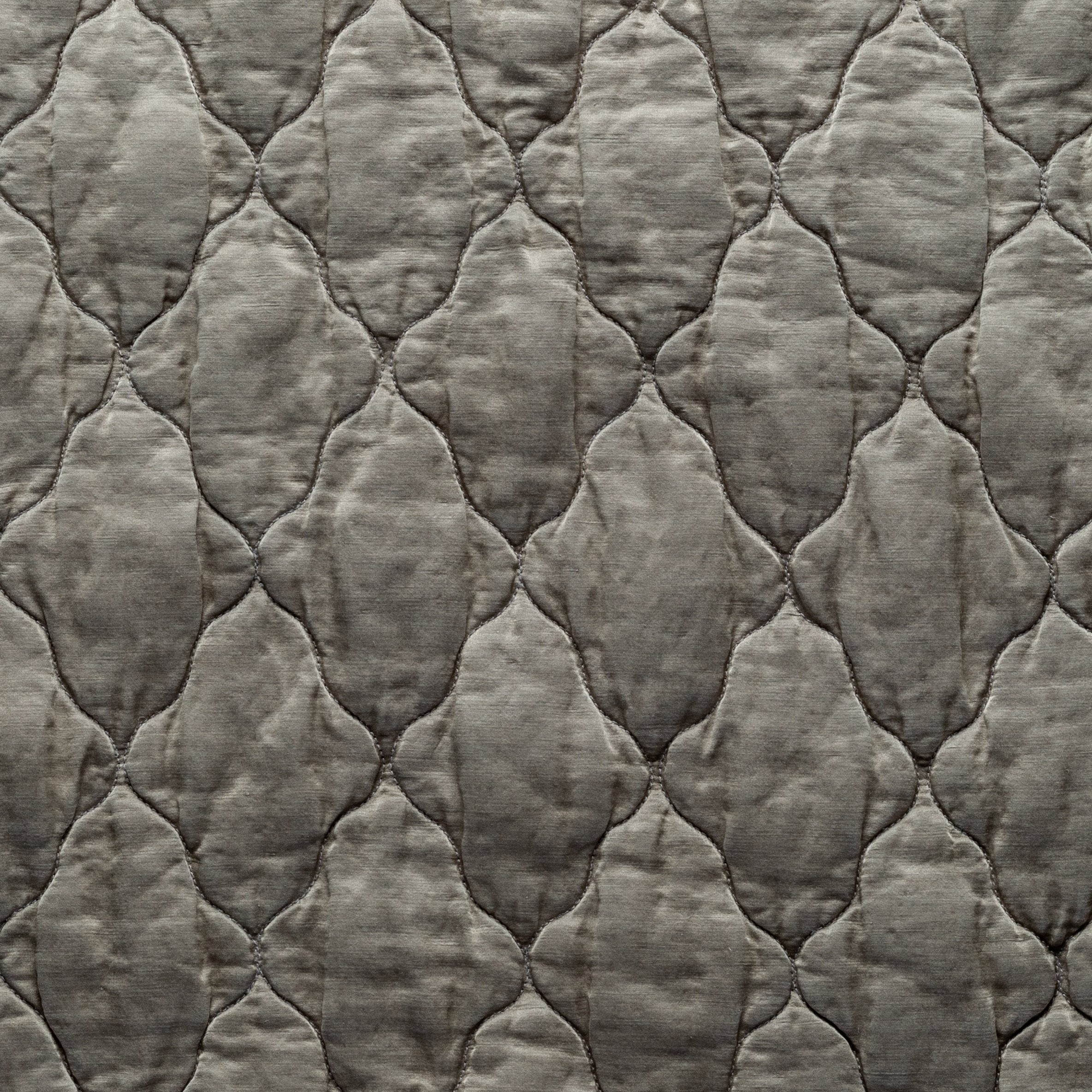 Moonlight: Close-up of Luna silk charmeuse quilting in moonlight, a saturated, cool, mid-dark grey tone. 