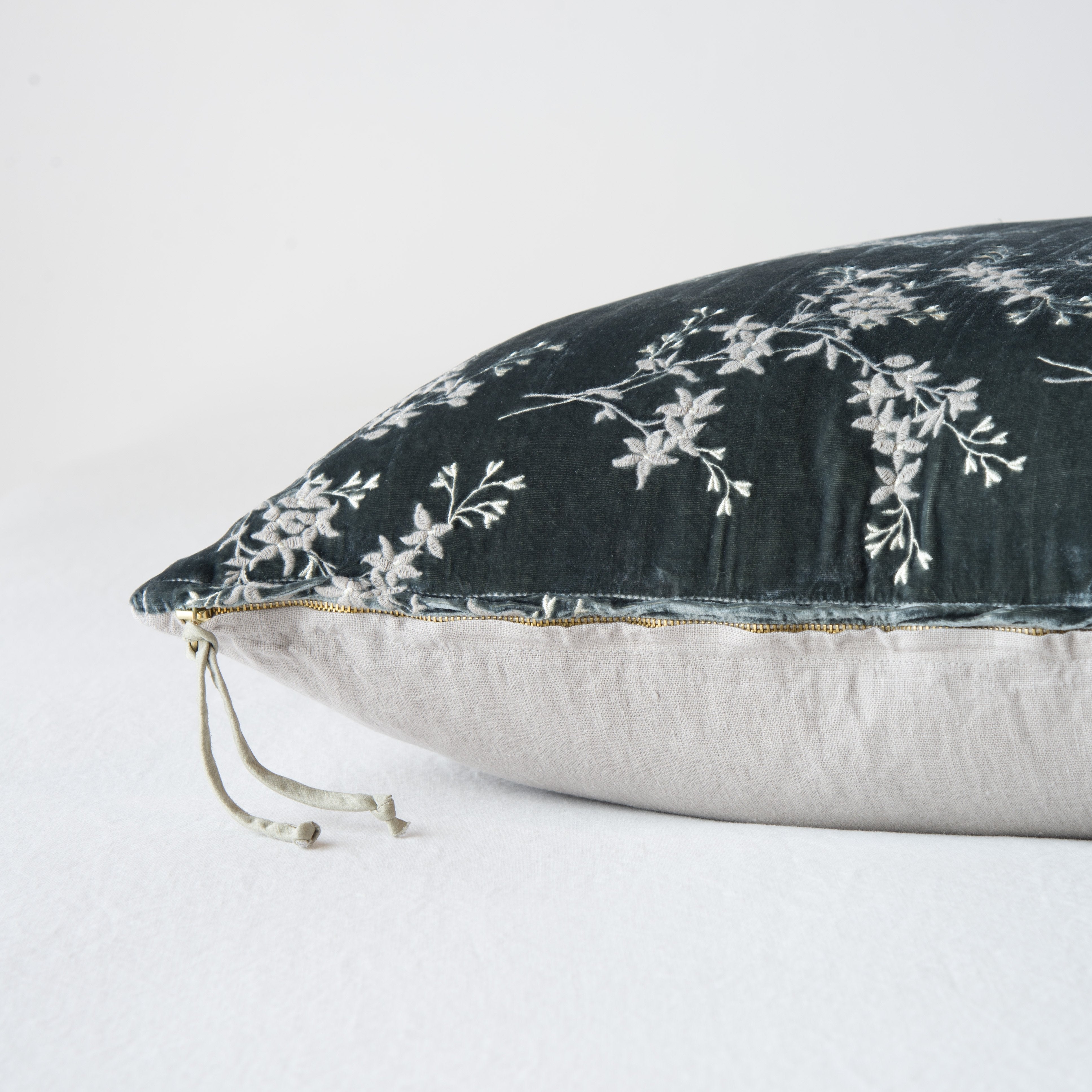 Fog: Close-up side vew featuring brass zipper with charmeuse pull, and linen back.