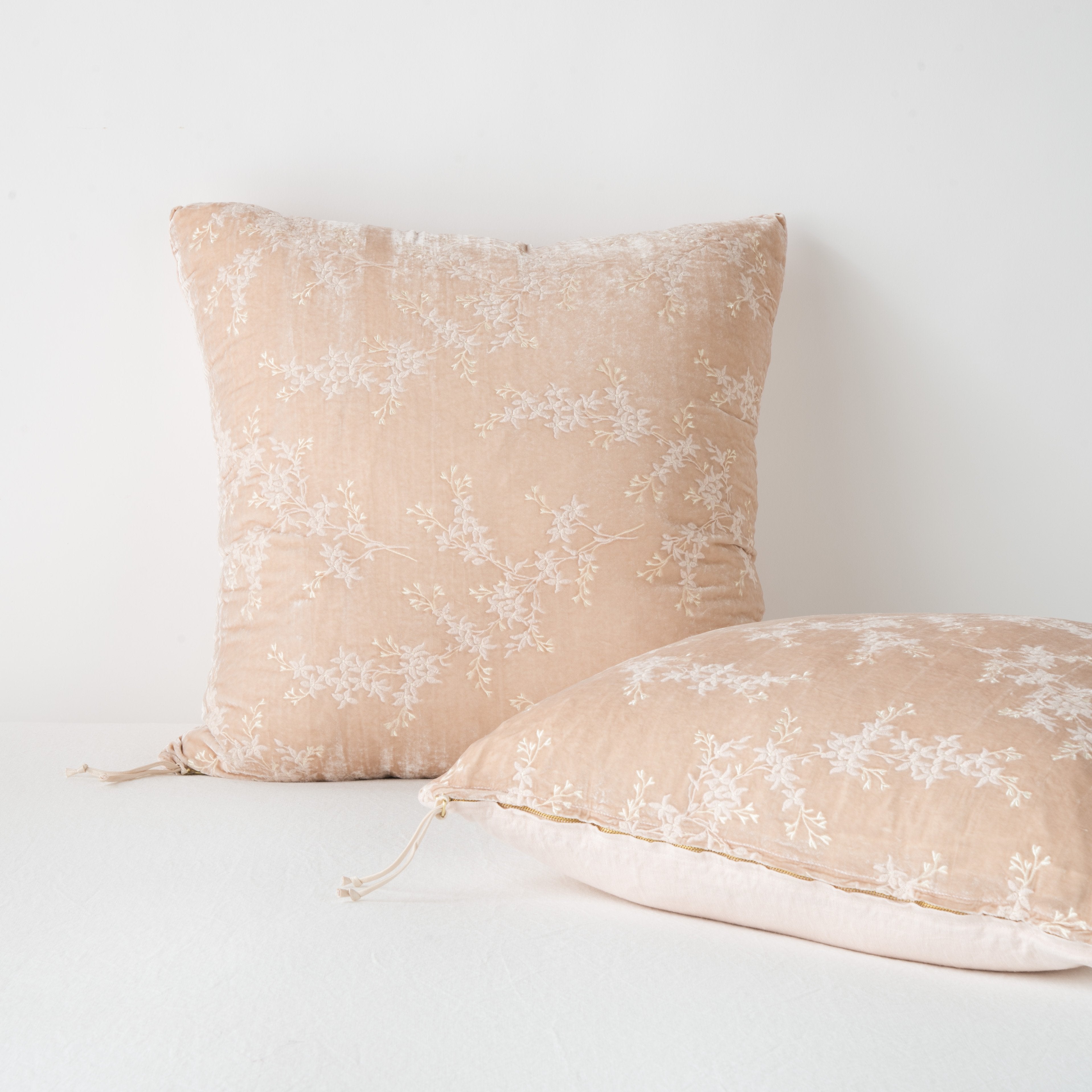 [allvariants]: Two Lynette shams against a light background: one upright and one laying flat, highlighting zipper detail and linen back.