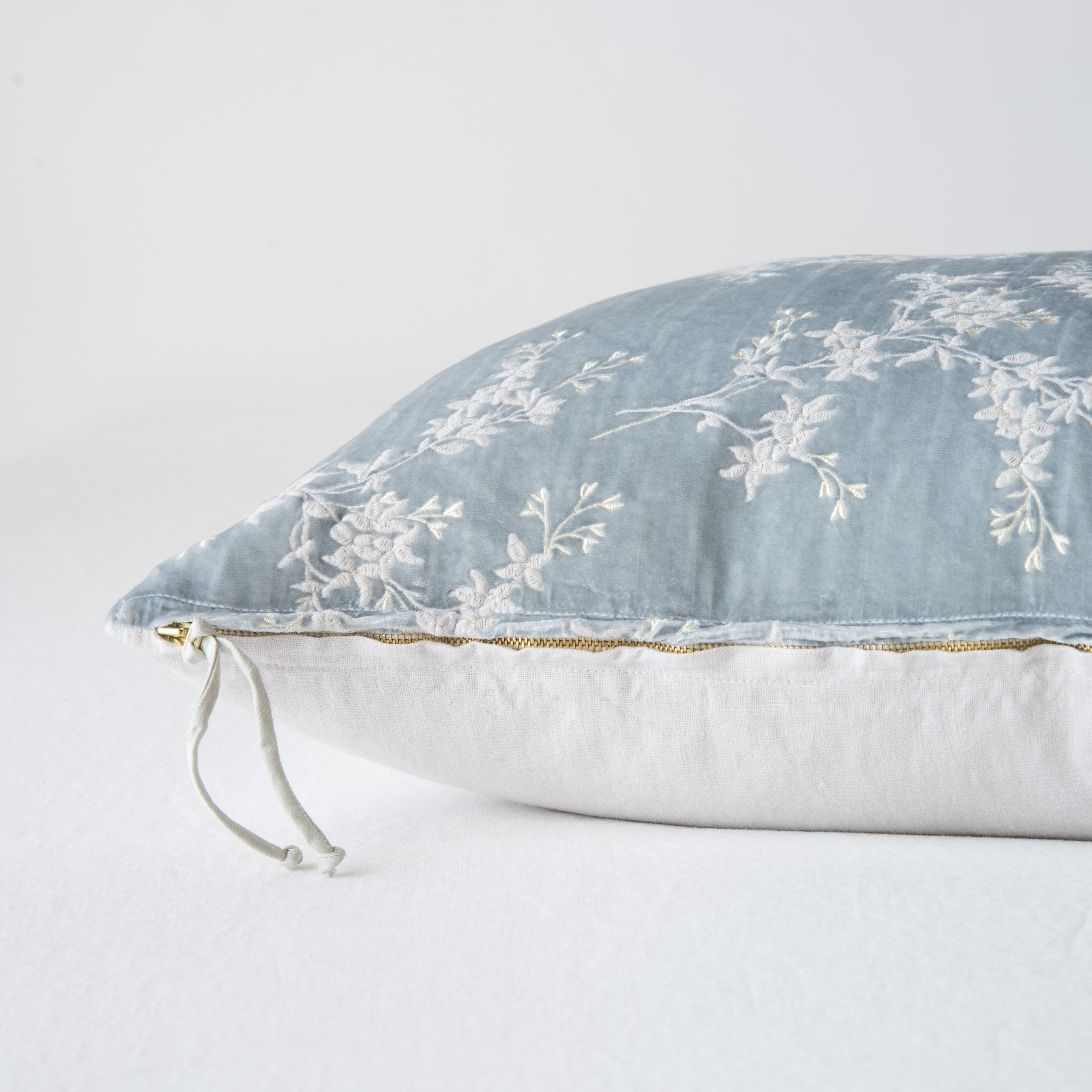 Sterling: Close-up side vew featuring brass zipper with charmeuse pull, and linen back.