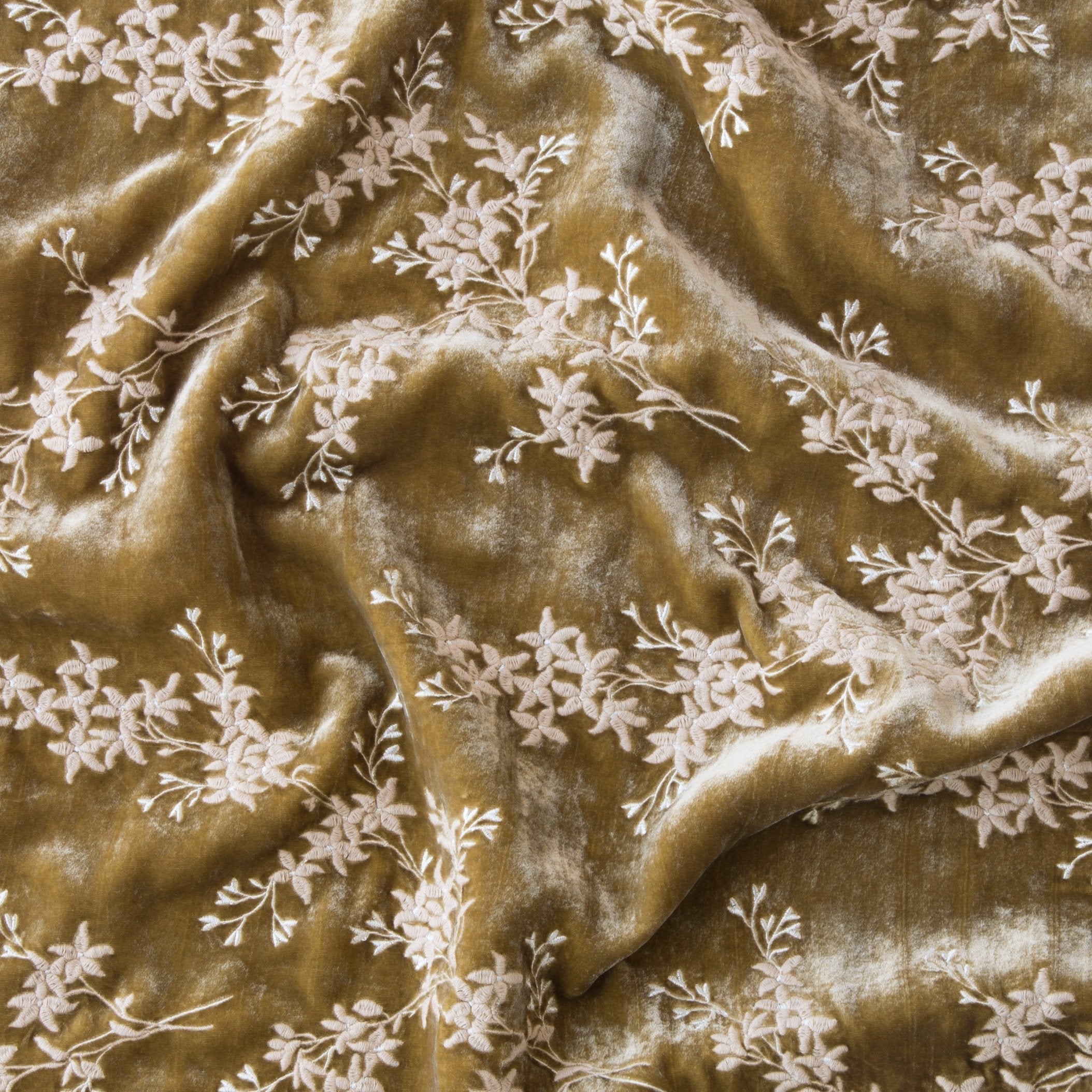 Honeycomb: A close up of Lynette embroidered silk velvet, in honeycomb, a warm golden tone.