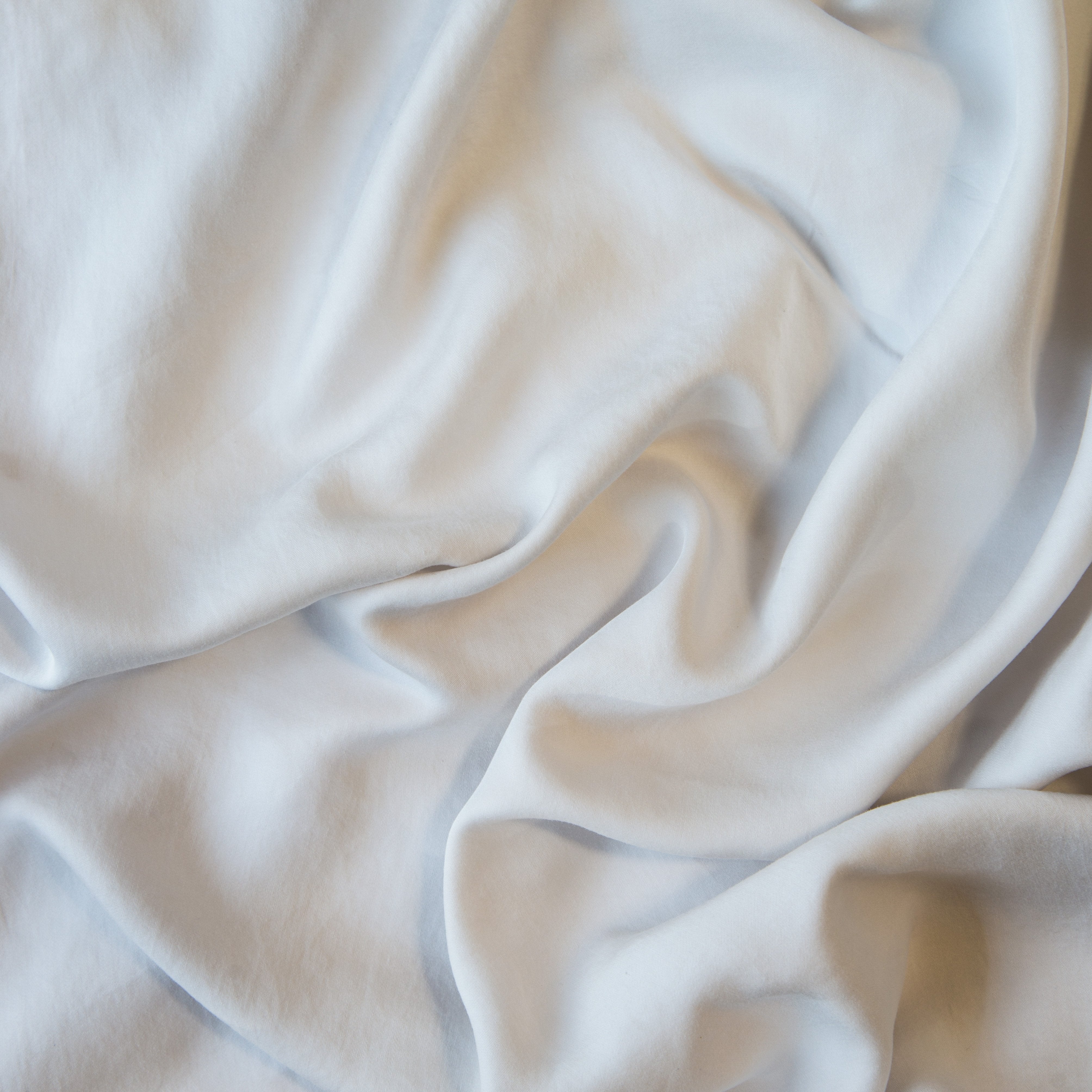  A close up of Tencel™ fabric in sterling, a silvery neutral light grey.