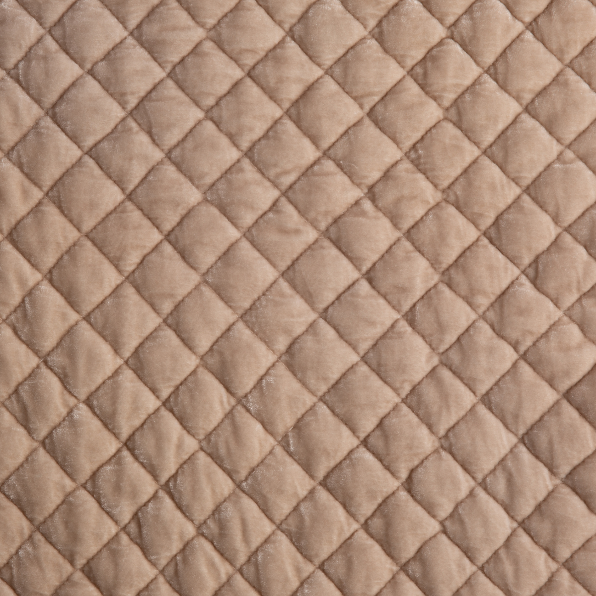 Rouge: Close-up of quilted silk velvet in rouge, a mid-tone blush pink.