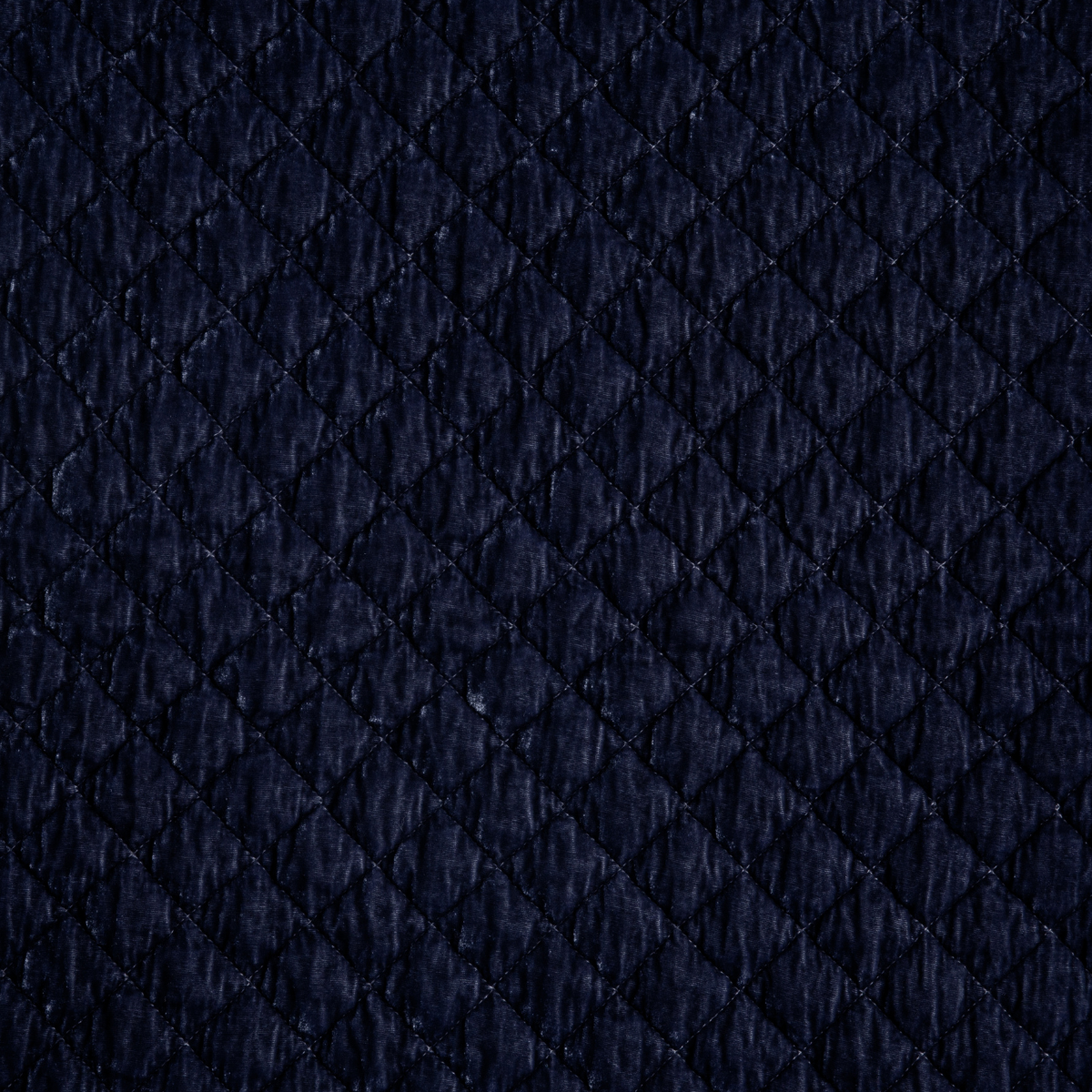 French Lavender: a close up of quilted silk velvet fabric in french lavender, a neutral violet tone.