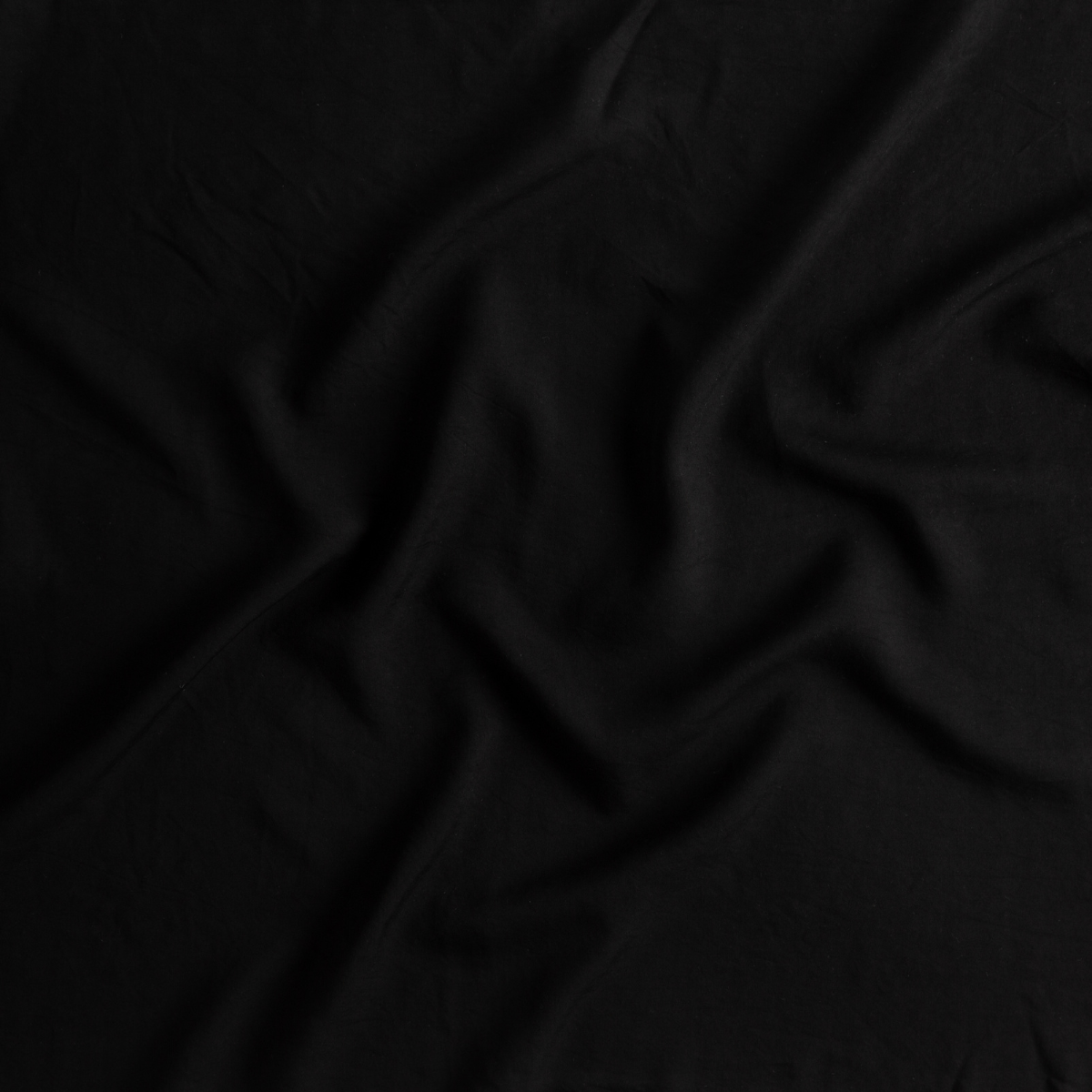 Corvino: A close up of Tencel™ fabric in Corvino, a black tone.