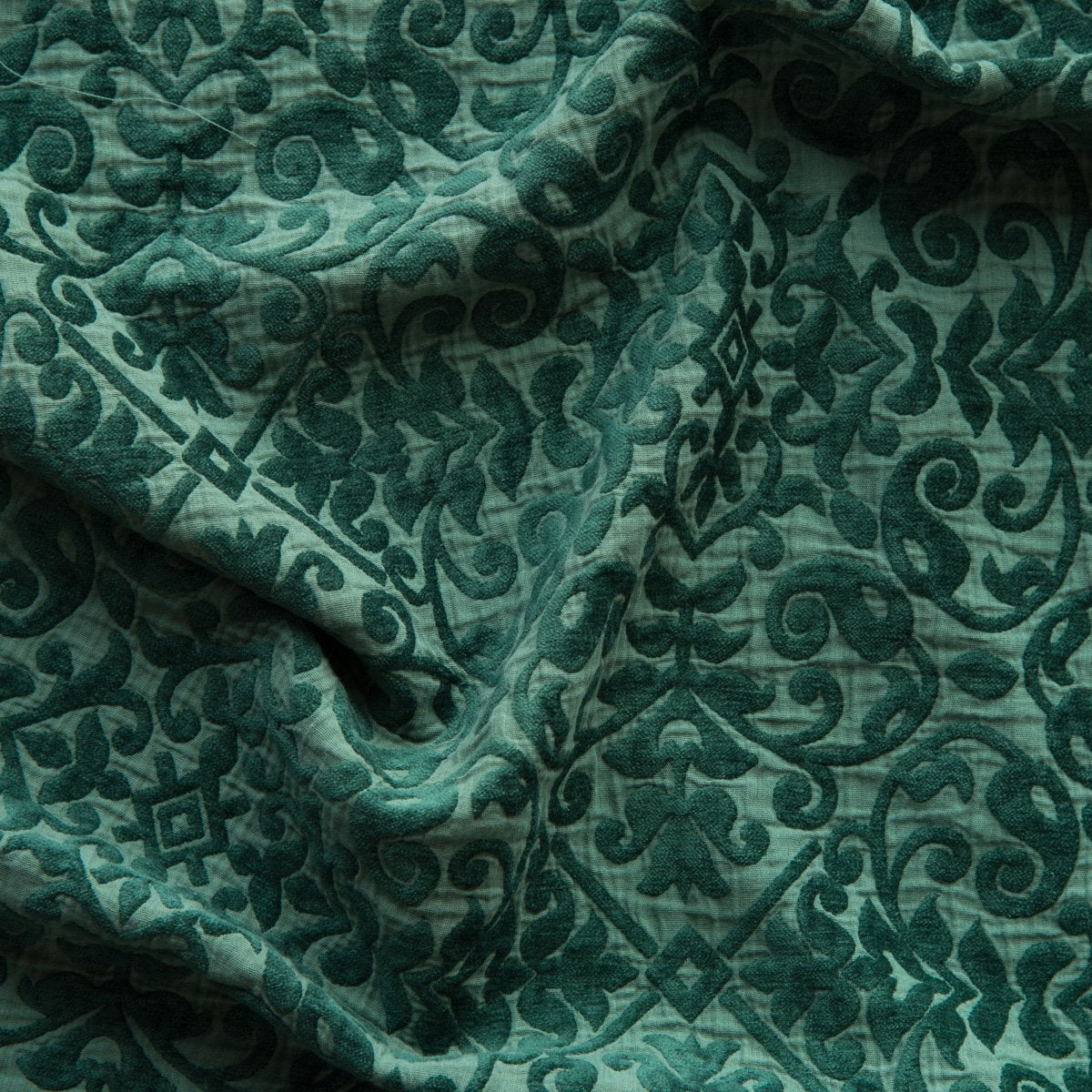 A close up of Vienna cotton chenille jacquard in jade, a rich, verdant green with subtle blue undertones.