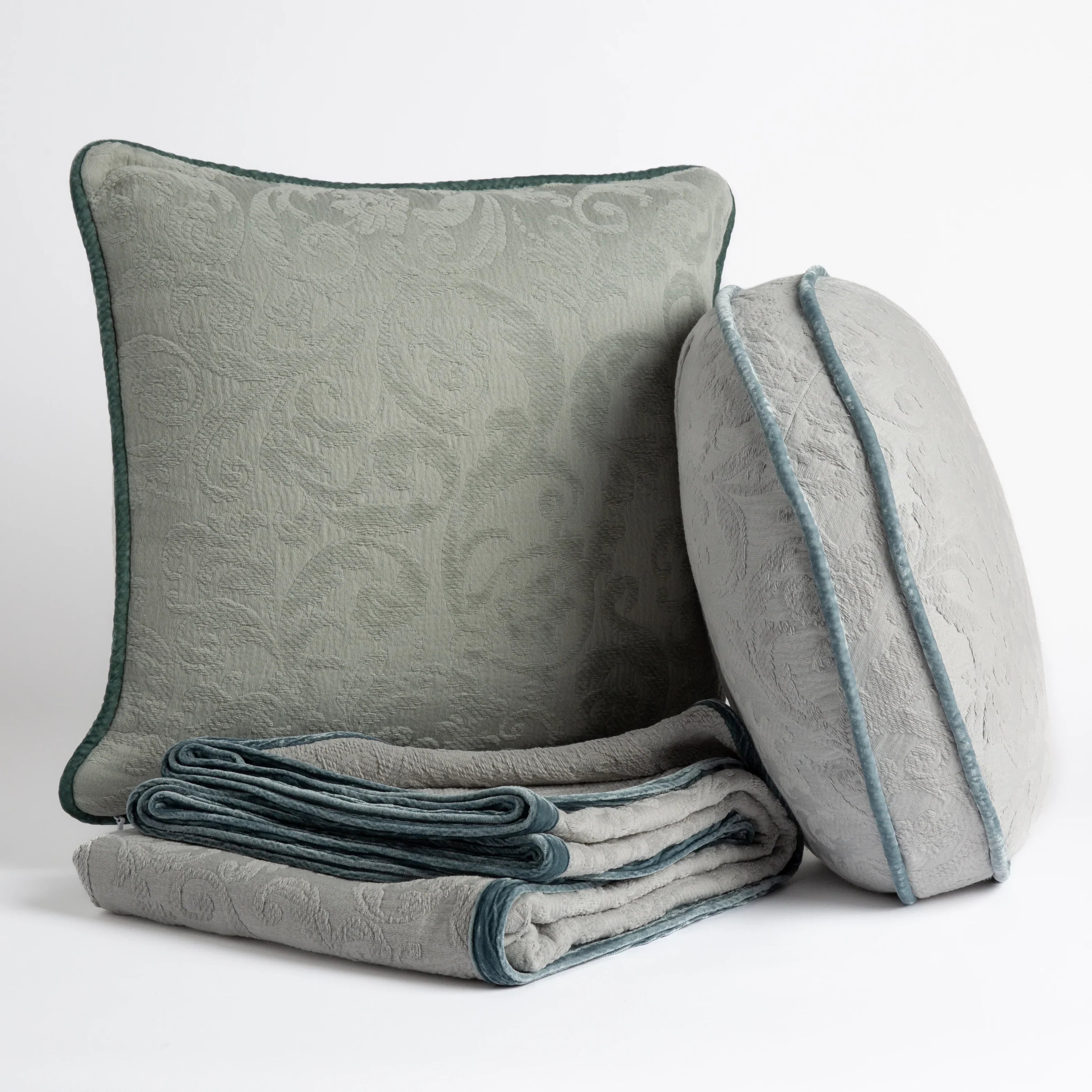 [allvariants]: Organic cotton damask throw pillows and throw blanket on a white background.