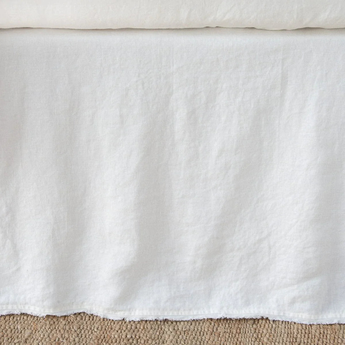 Winter White: Close up of the Austin bed skirt in winter white, highlighting its tailored, ungathered style.