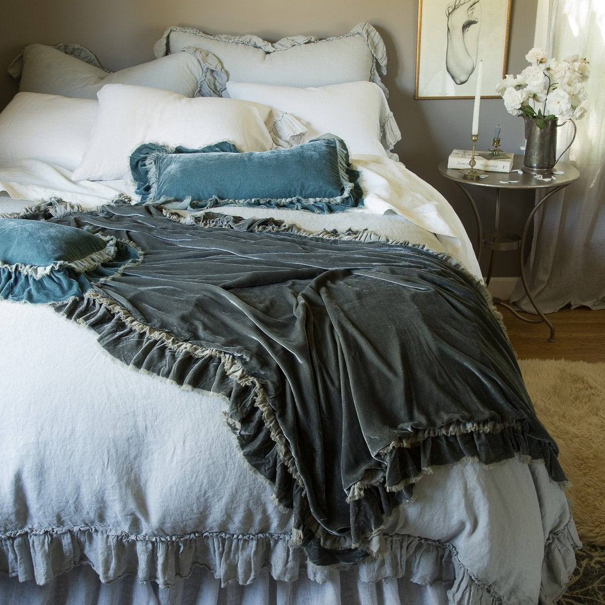 [allvariants]: Loulah Accent pillows with matching throw blanket, layered over a Linen Whisper bed, highlighing how to mix ruffles in different textures.