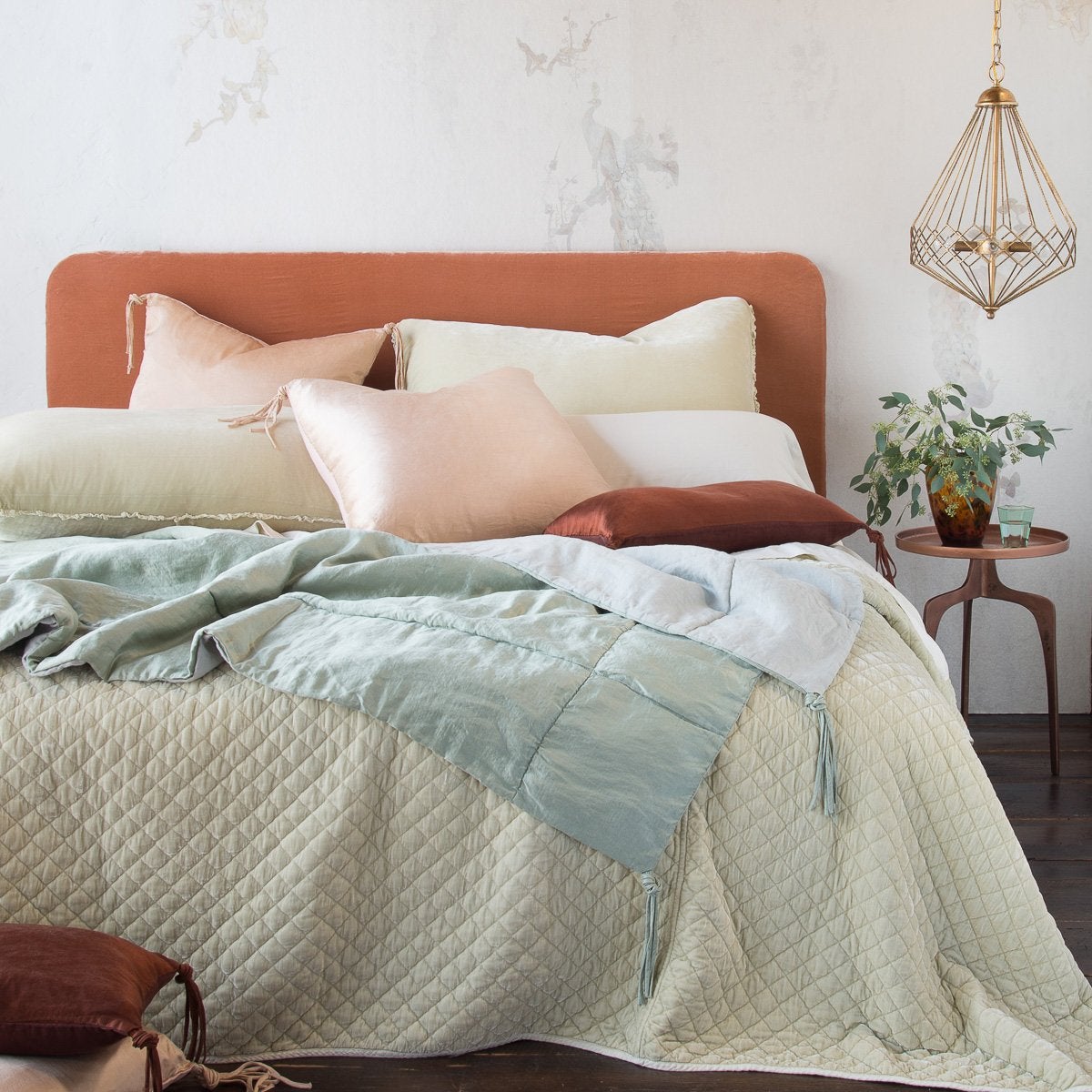 [allvariants]: Taline silk charmeuse pairs beautifully with silk velvet and quilted silk velvet in pale cream, pink, and blue tones with mahogany accents - end of bed view.
