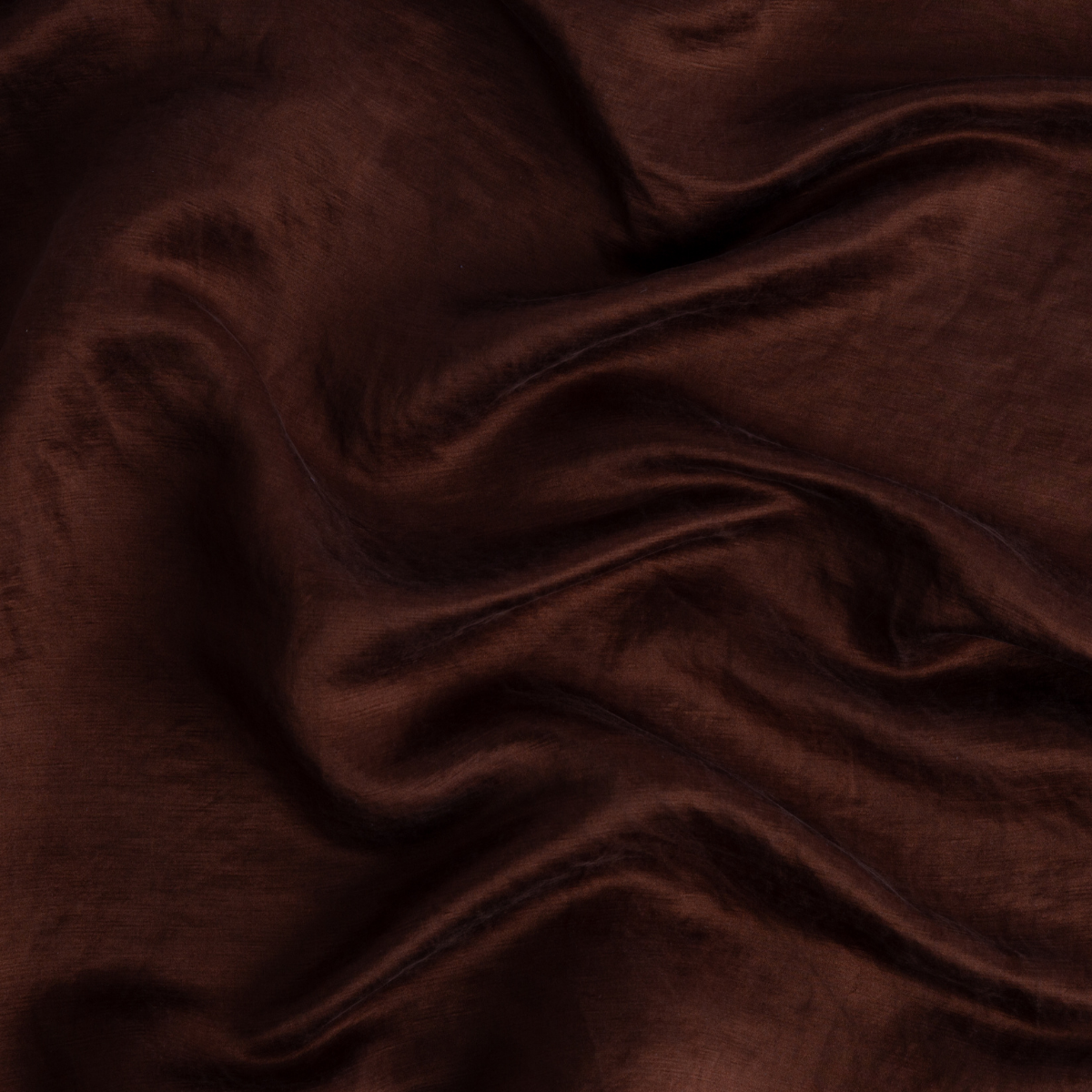 Mahogany: Close-up of silk charmeuse in mahogany, a deep, earthen, reddish brown. 