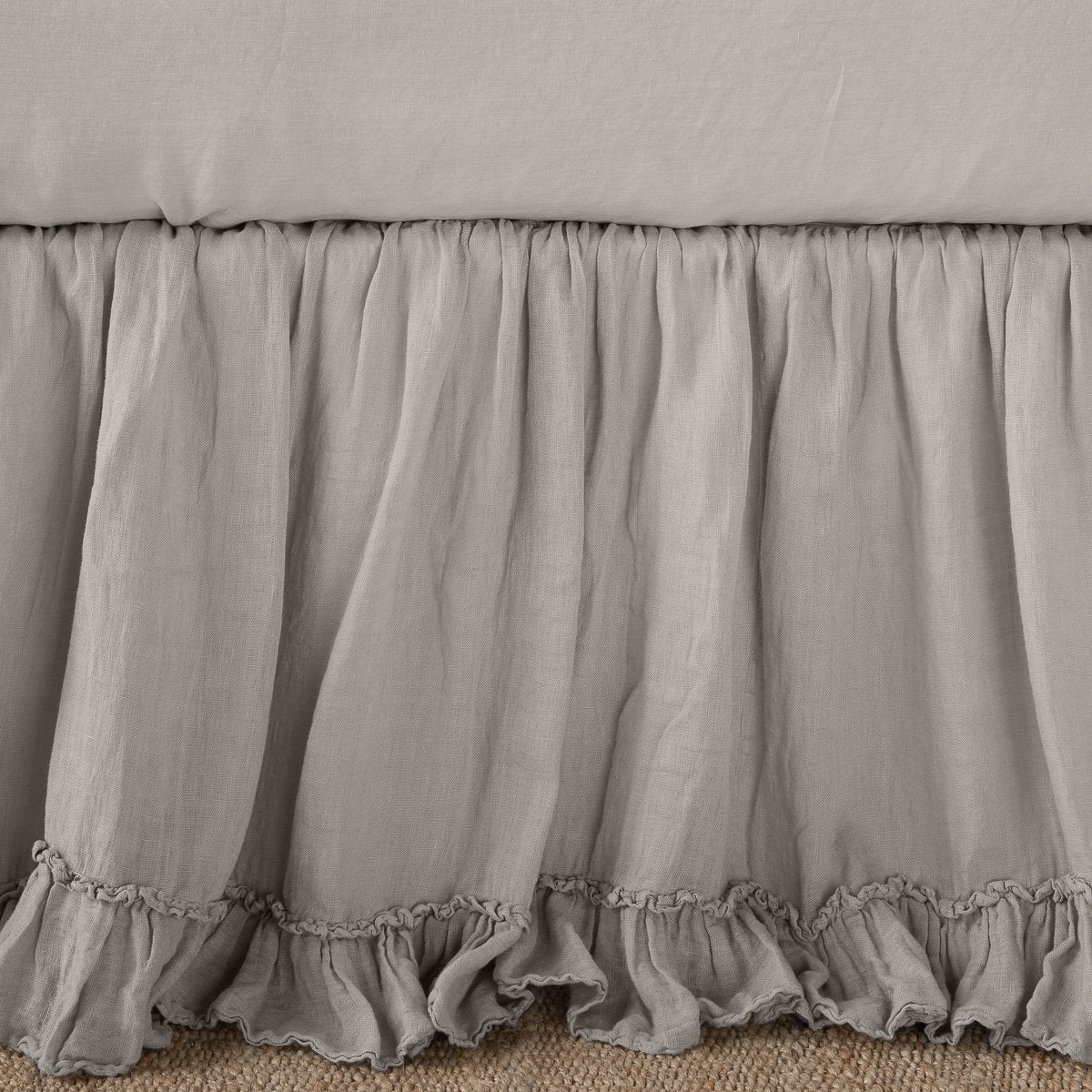 Fog: Close up of bed skirt, showcasing ruffle detail - side view.