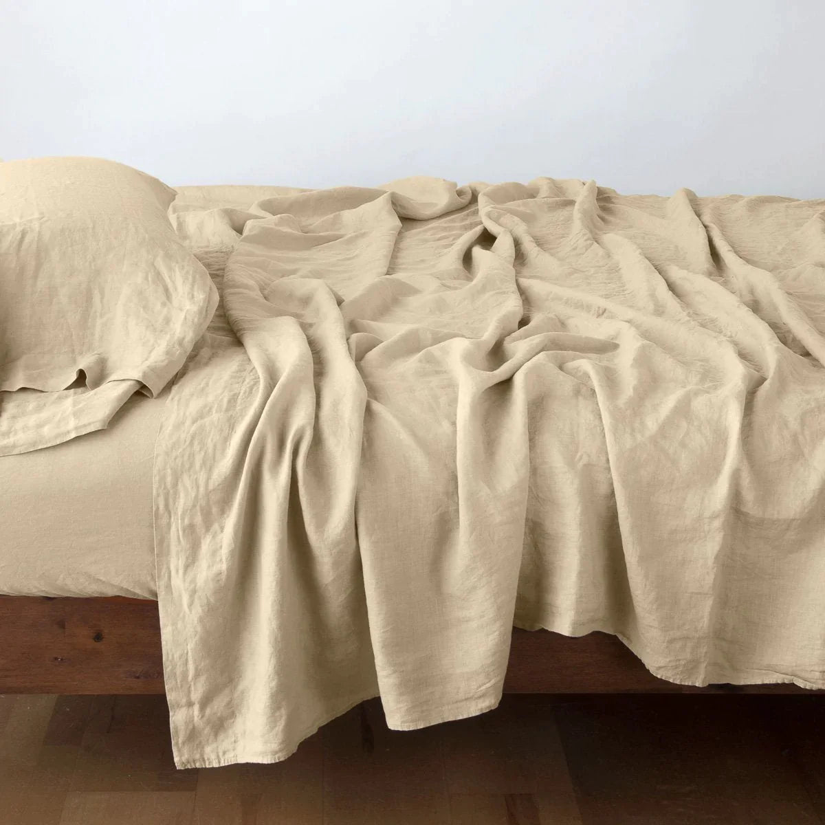Honeycomb: fitted sheet with matching rumpled flat sheet and sleeping pillow - side view.