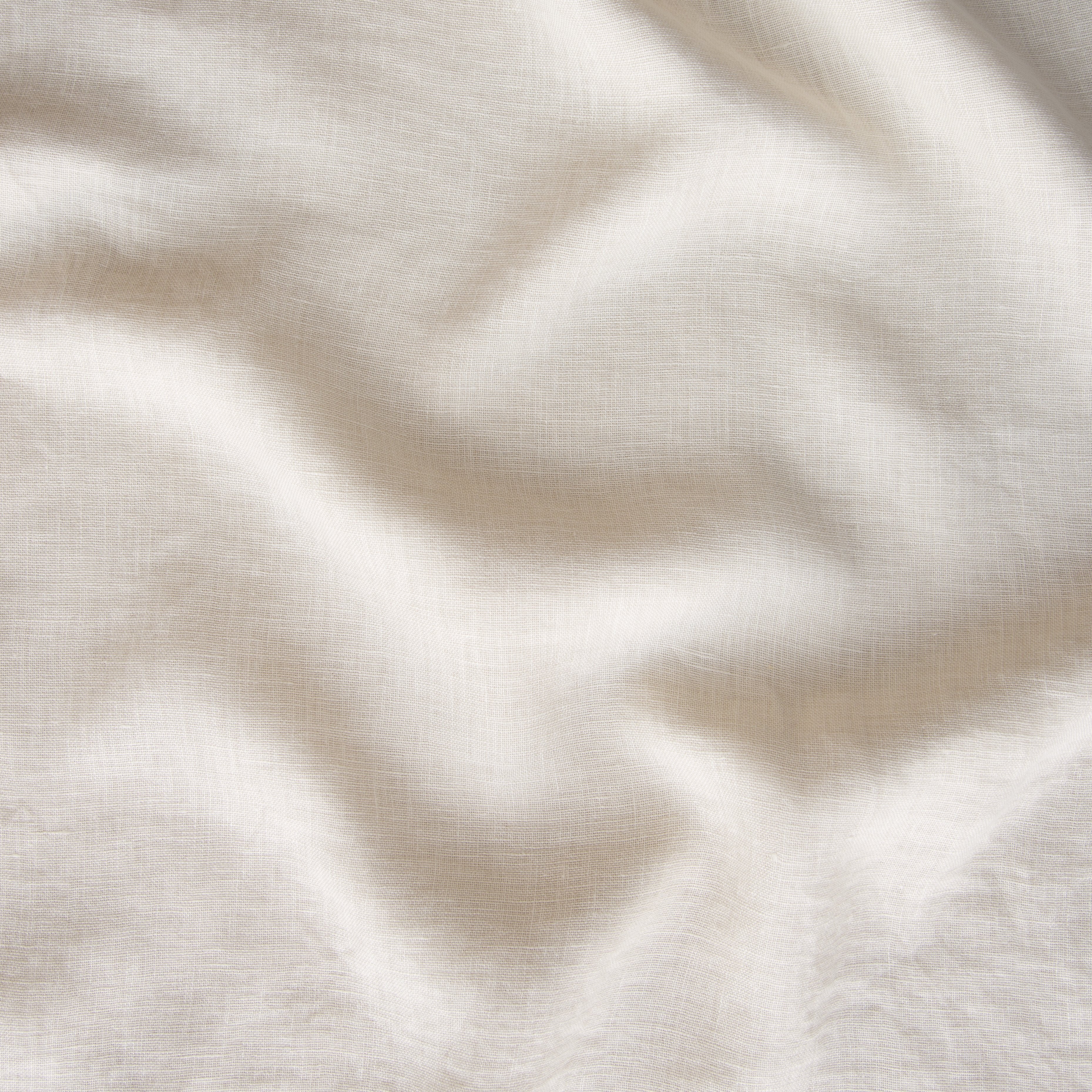 Parchment: A close up of linen whisper, our lightweight linen gauze, in winter white, softer and warmer in tone than classic white.