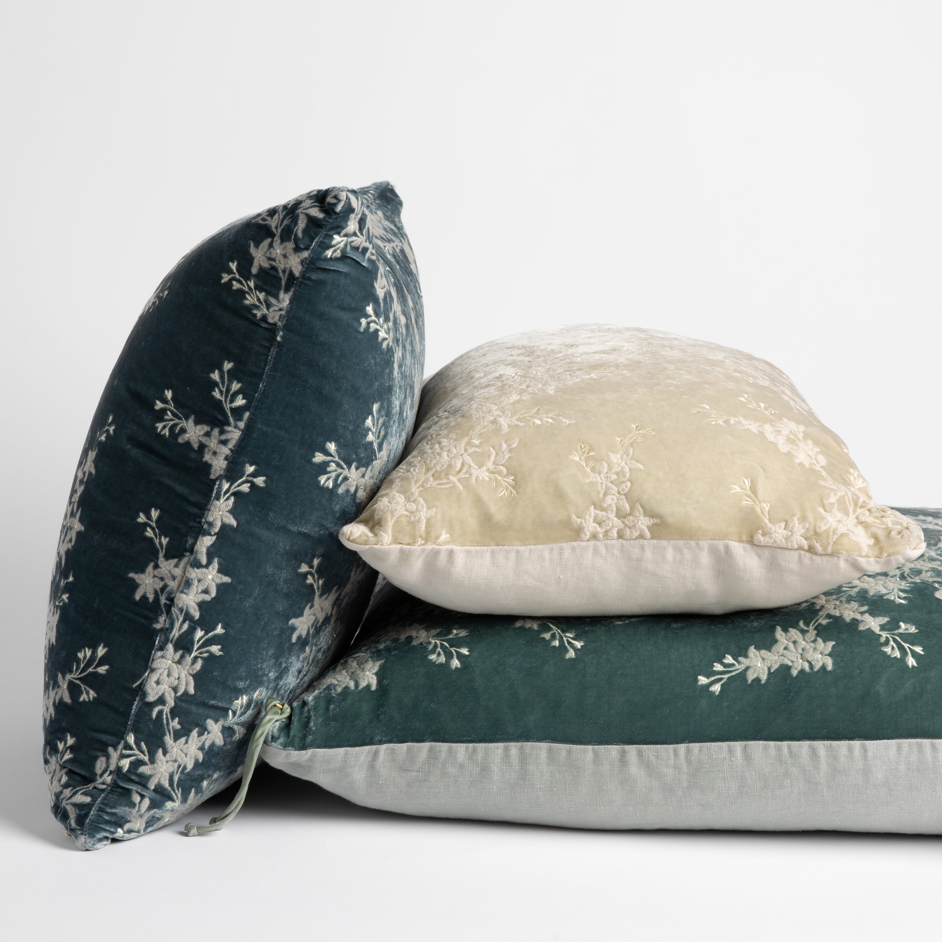 [allvariants]: embroidered silk velvet throw pillows stacked to show both sides of all pillow styles — straight on against a white background. 
