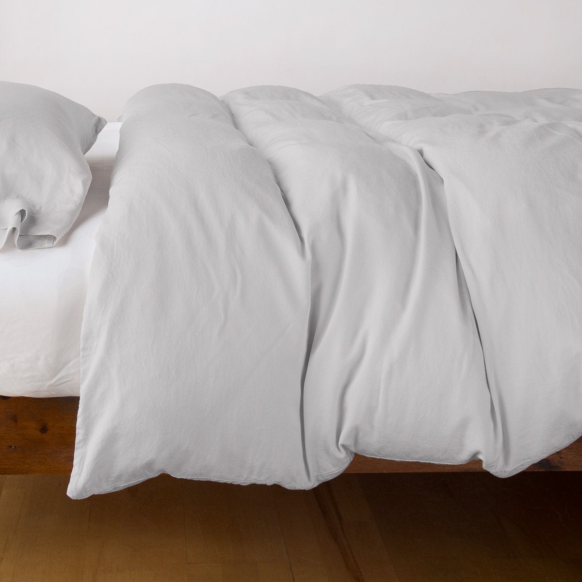 Sterling: duvet cover with matching sleeping pillow and fitted sheet - side view.