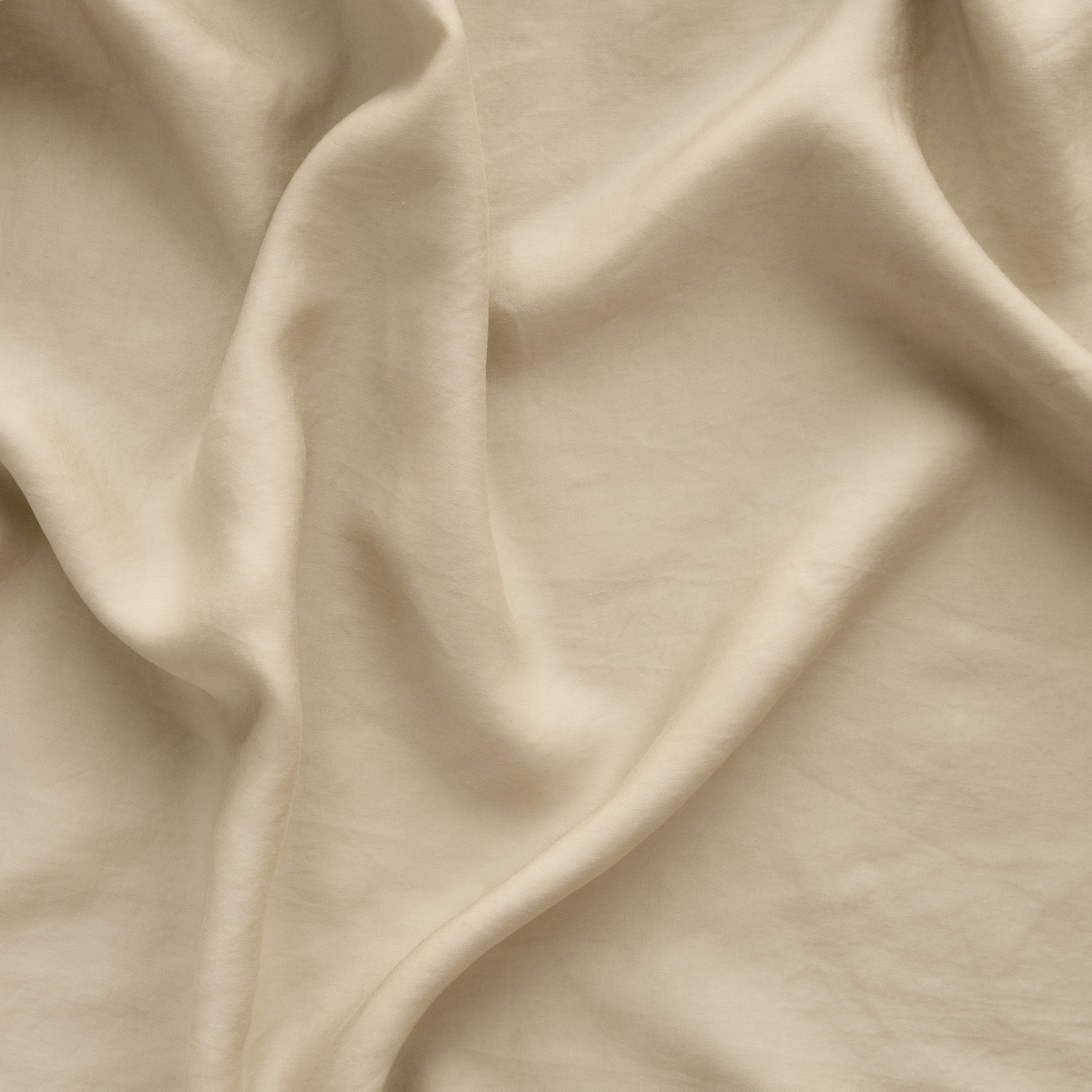 Honeycomb: A close up of Tencel™ fabric in honeycomb, a warm golden tone.
