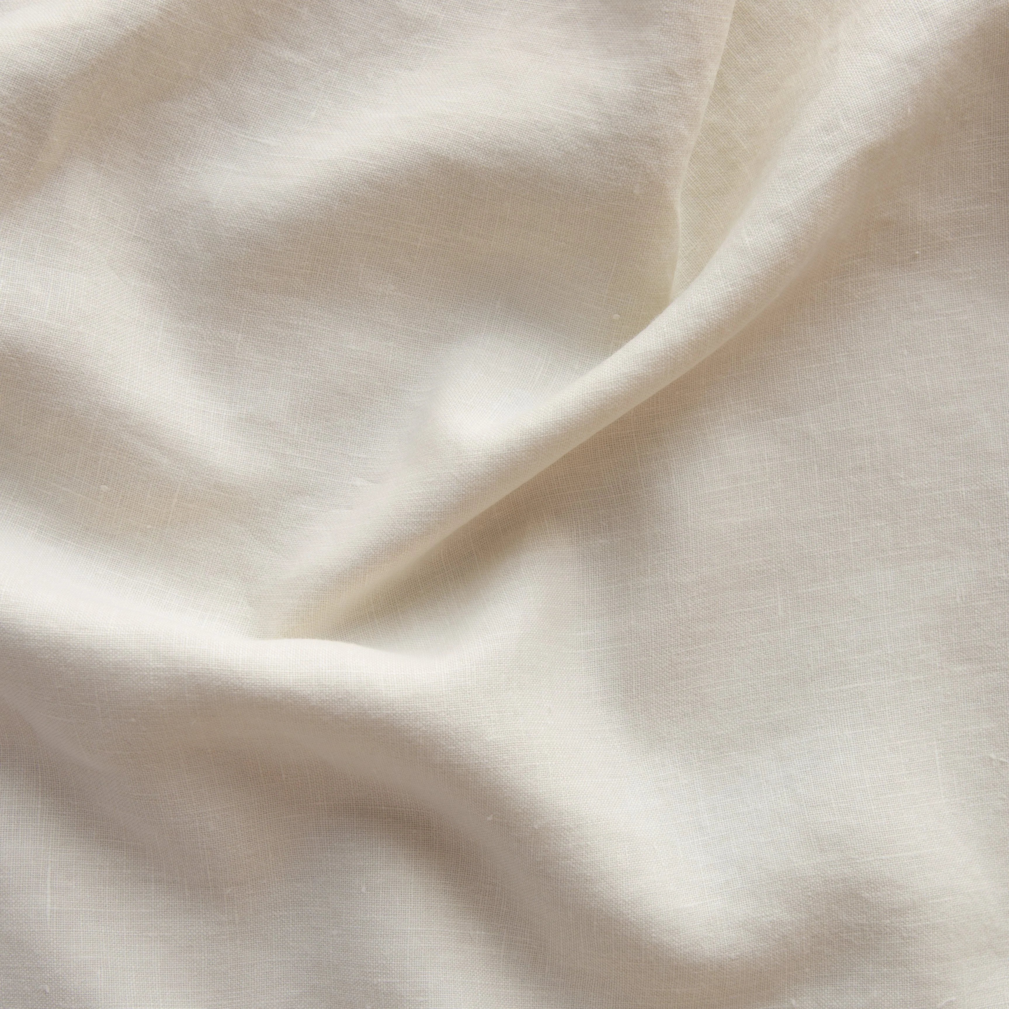 Parchment: A close up of midweight linen in parchment, a warm, antiqued cream. 