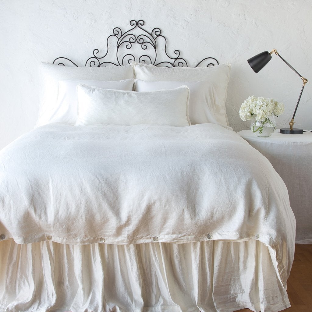 Winter White: bed skirt with matching duvet and pillows - end of bed view.
