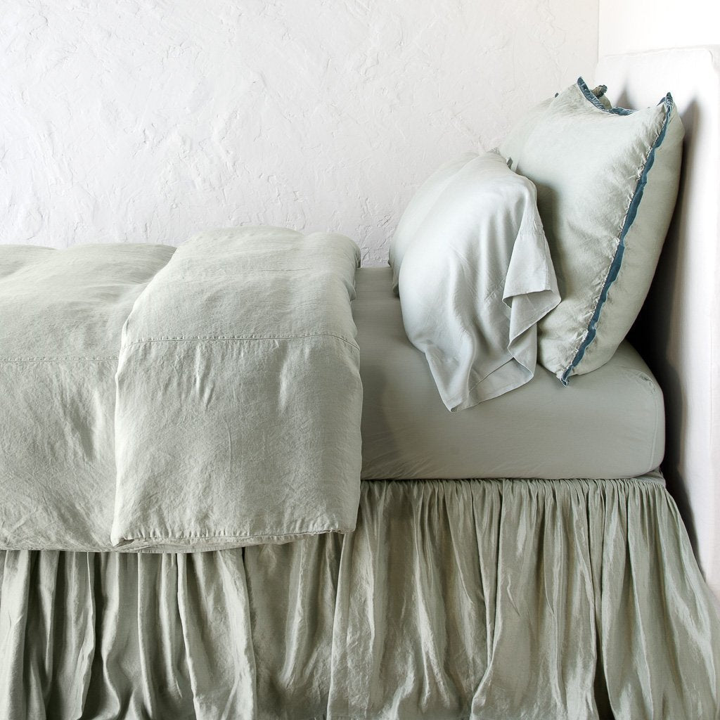 Eucalyptus: duvet cover with matching pillows and bed skirt - side view.