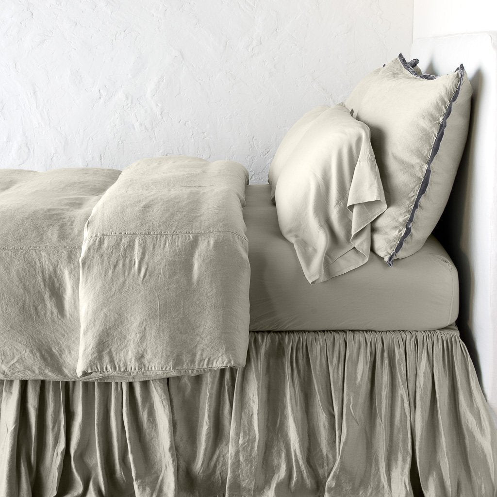 Fog: duvet cover with matching pillows and bed skirt - side view.