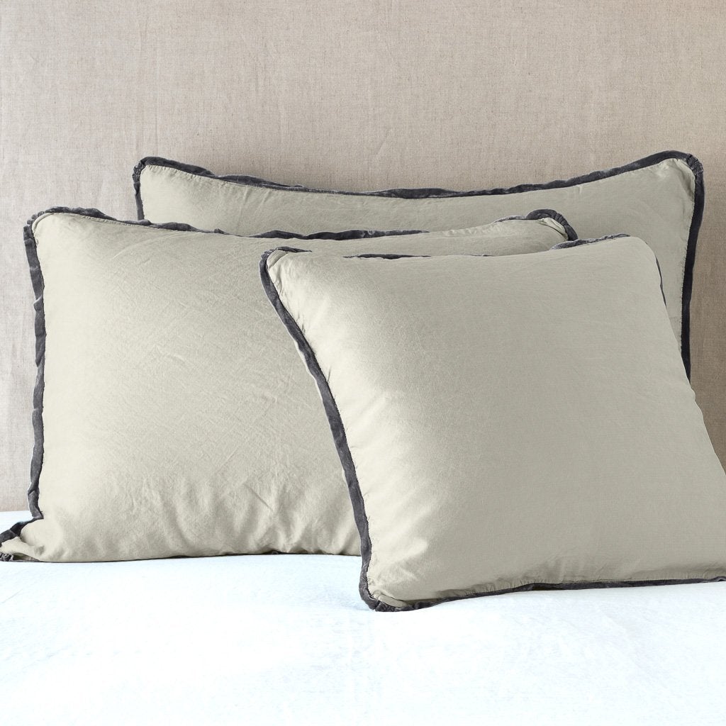 [allvariants]: Paloma shams leaning upright on white sheeting against a neutral headboard - fog.