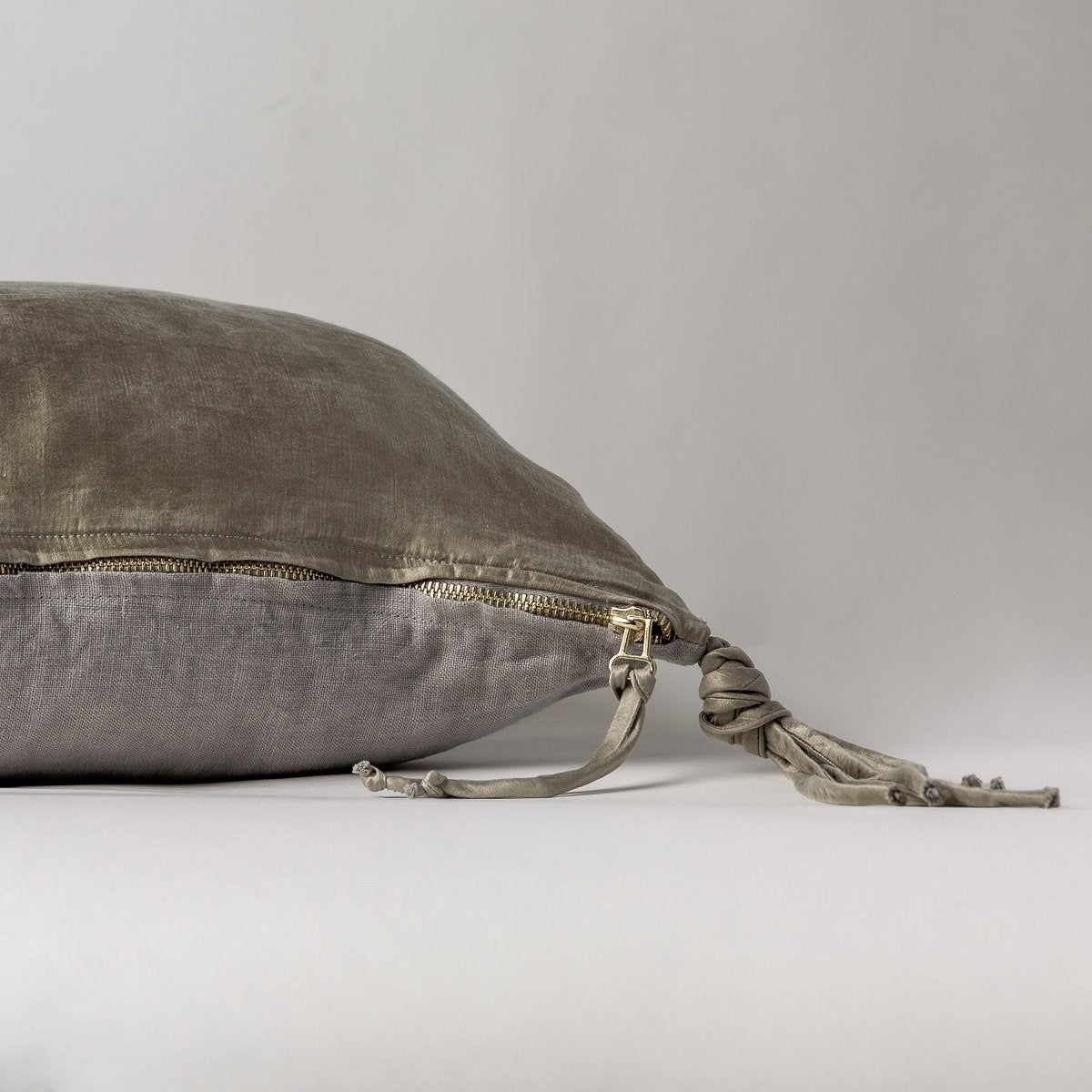 Moonlight: Close-up side vew featuring brass zipper with charmeuse pull and linen back.