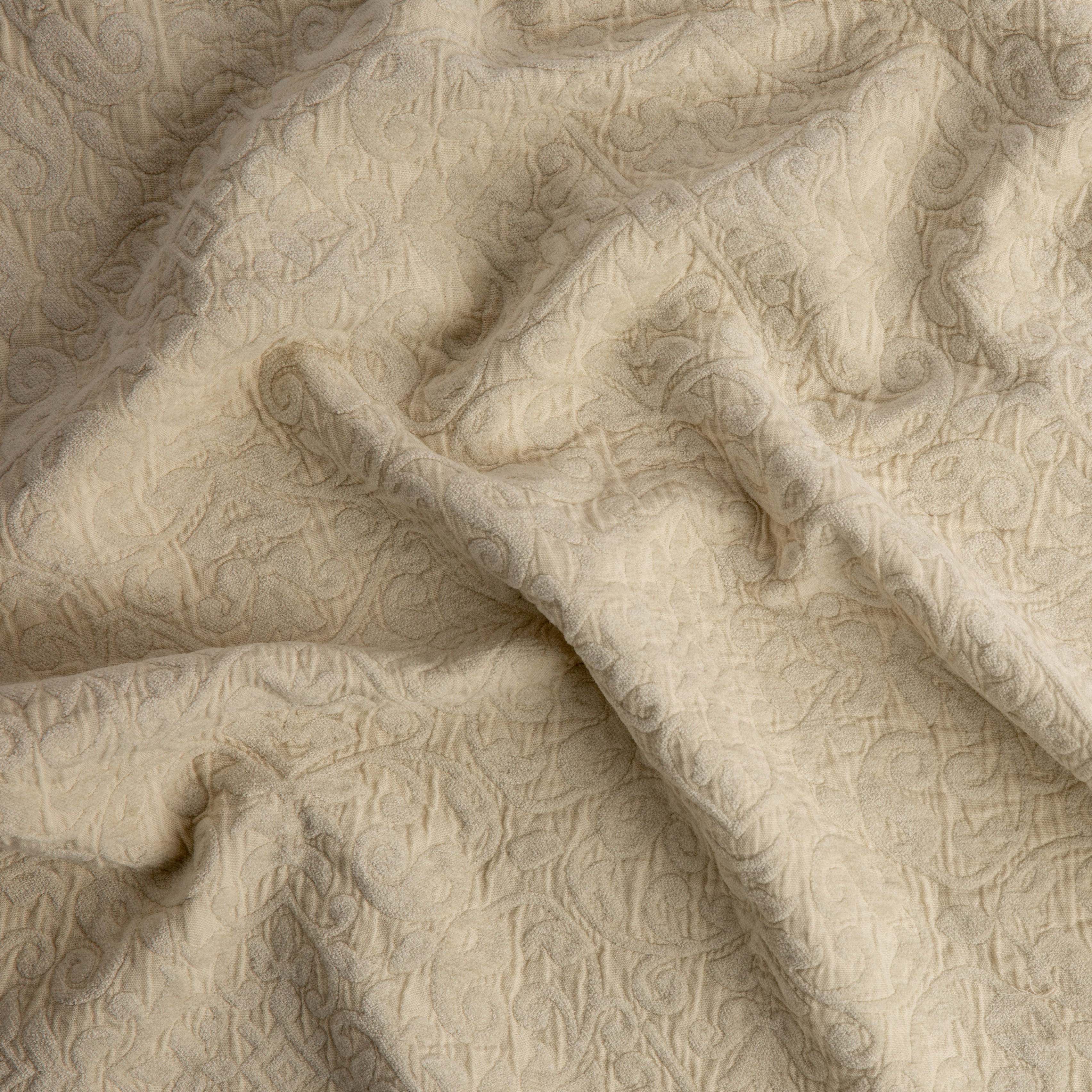 Parchment: A close up of Vienna cotton chenille jacquard in parchment, a warm, antiqued cream. 
