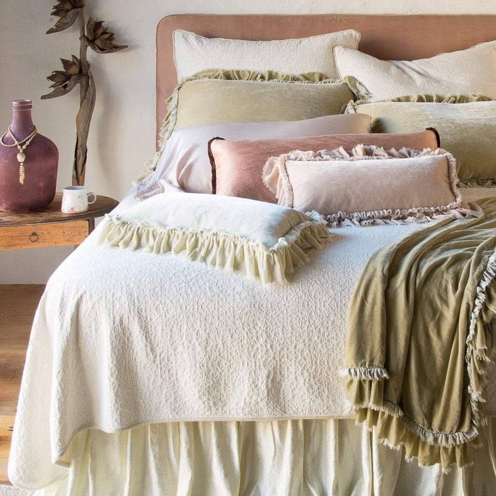 : Vienna Coverlet and shams add beautiful jacquard texture under ruffled silk velvet, in soft cream, pink and gold tones - end of bed view.