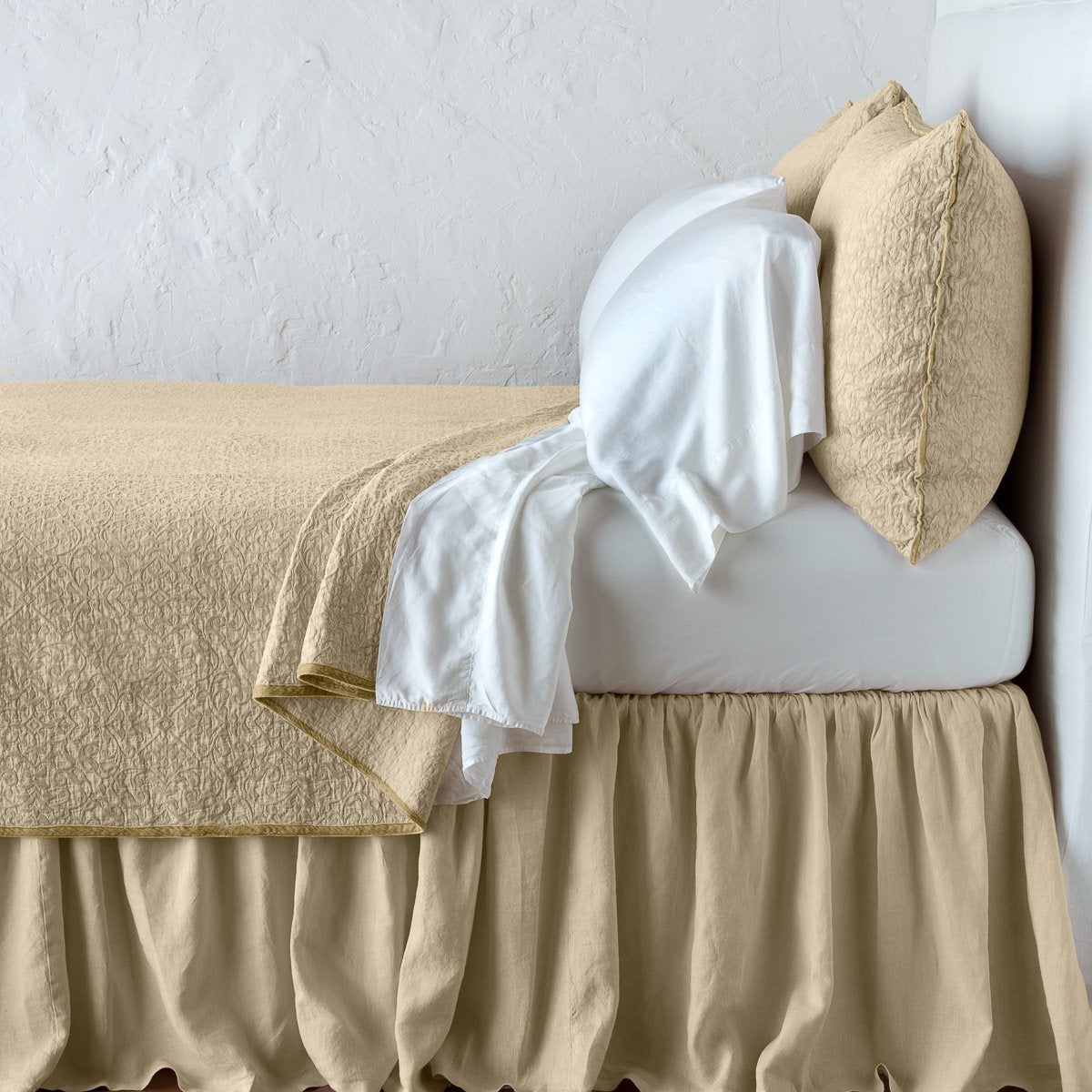 Honeycomb: Cotton chenille jacquard coverlet and matching sham over white sheeting - side view.