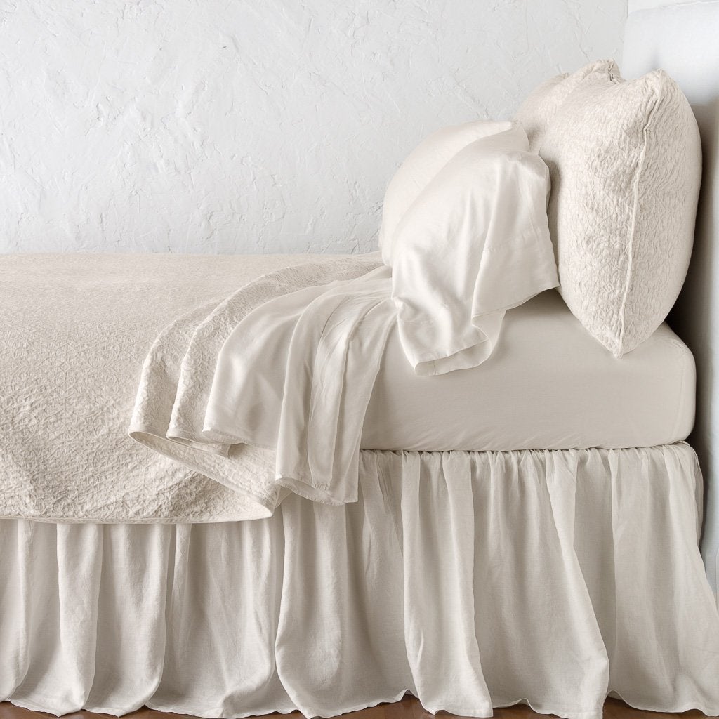 Parchment: Cotton chenille jacquard coverlet and matching sham over white sheeting - side view.