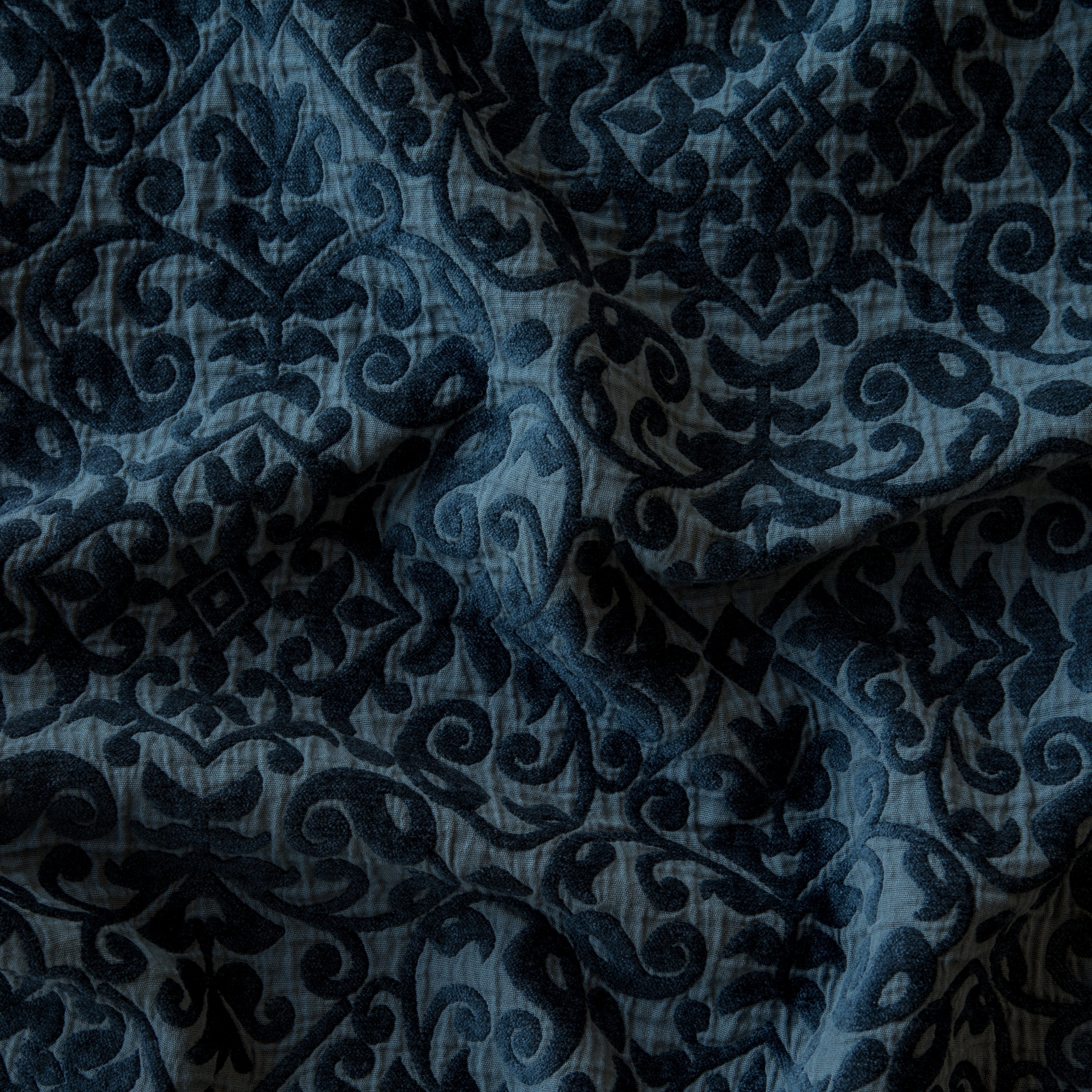 Midnight: A close up of Vienna cotton chenille jacquard in midnight, a rich indigo tone. 